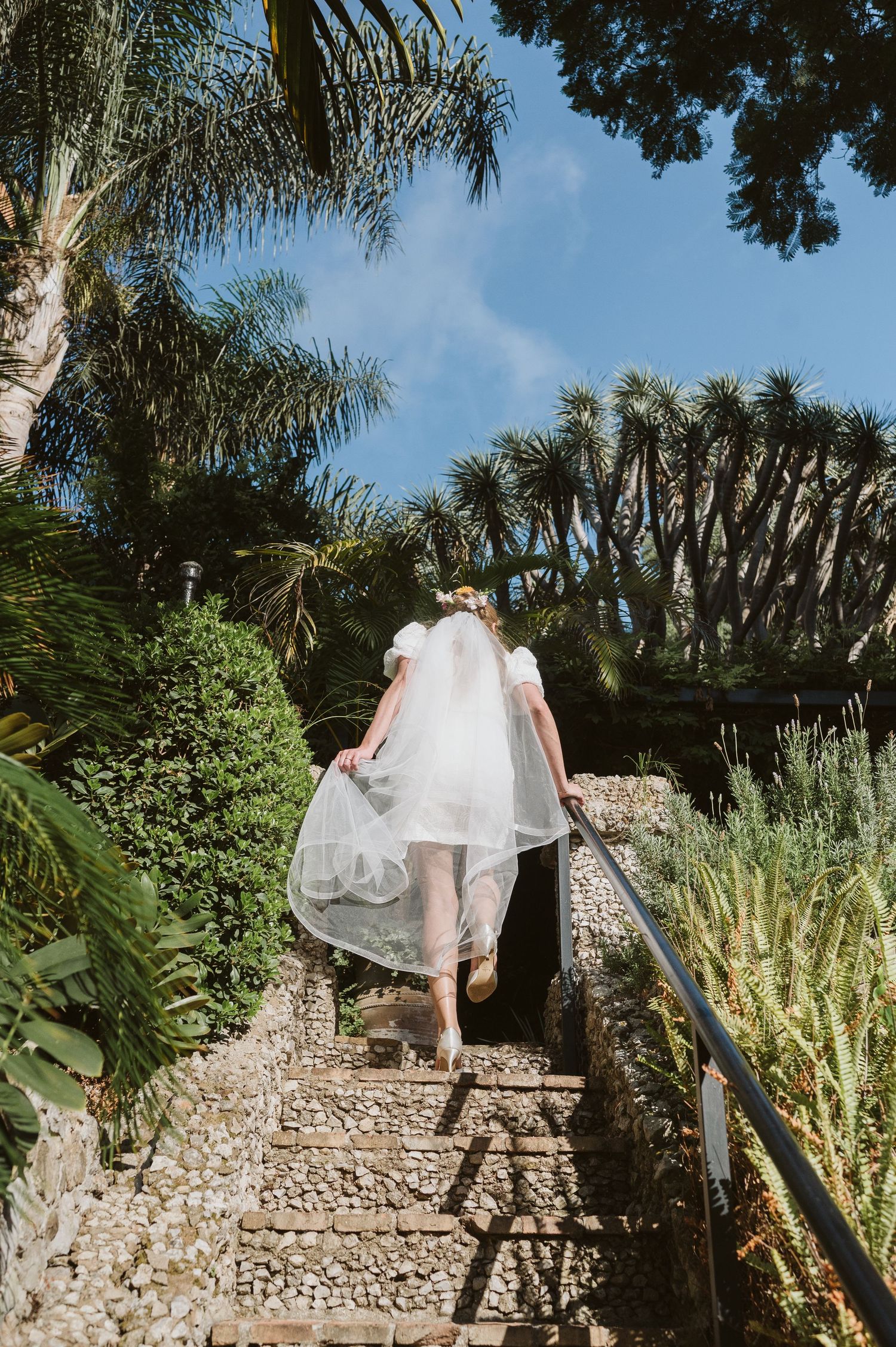 Bride at The Dell ceremony space surrounded by landscaped gardens in Gibraltar