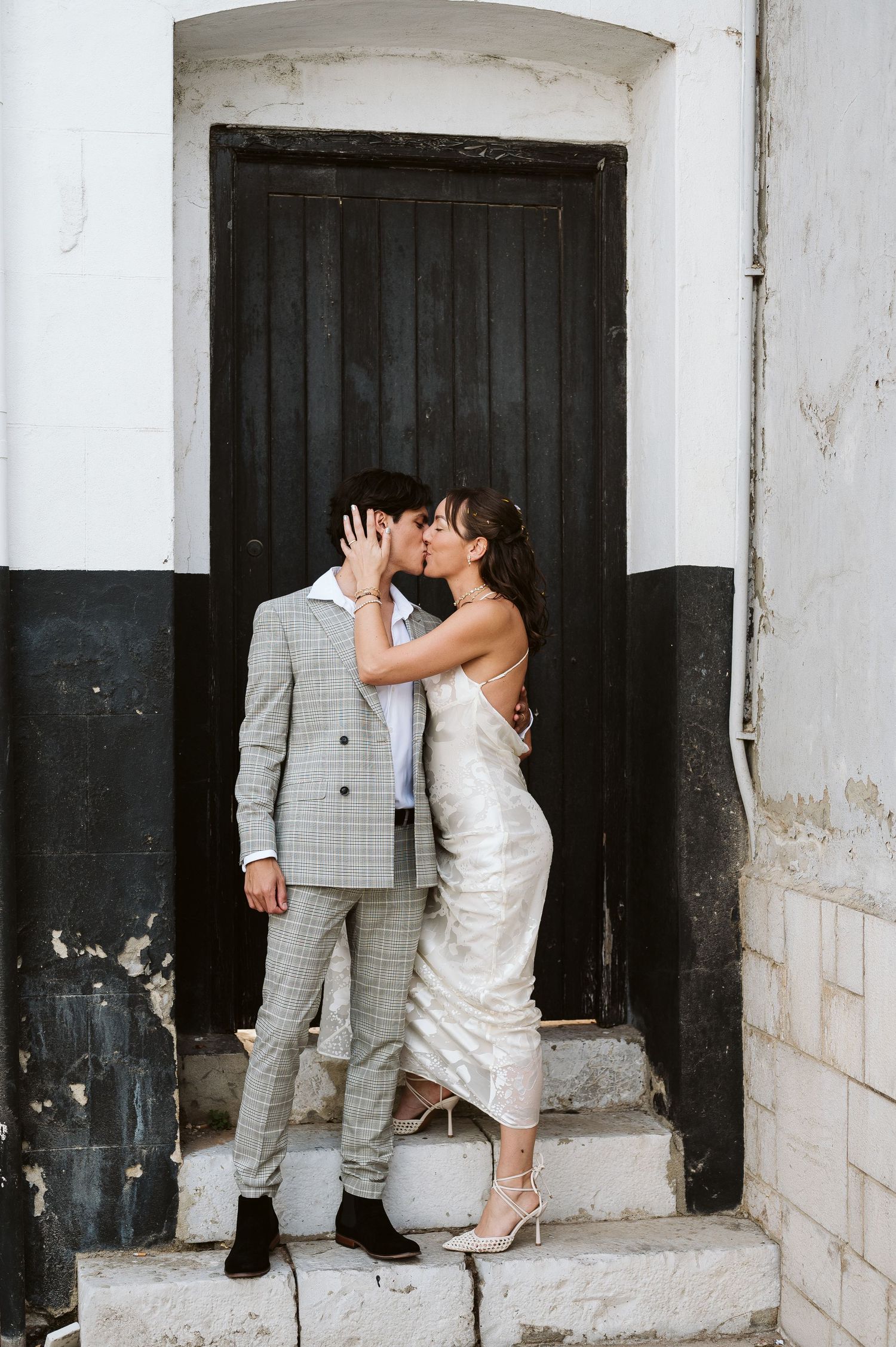 bride holding her groom for a cute photo