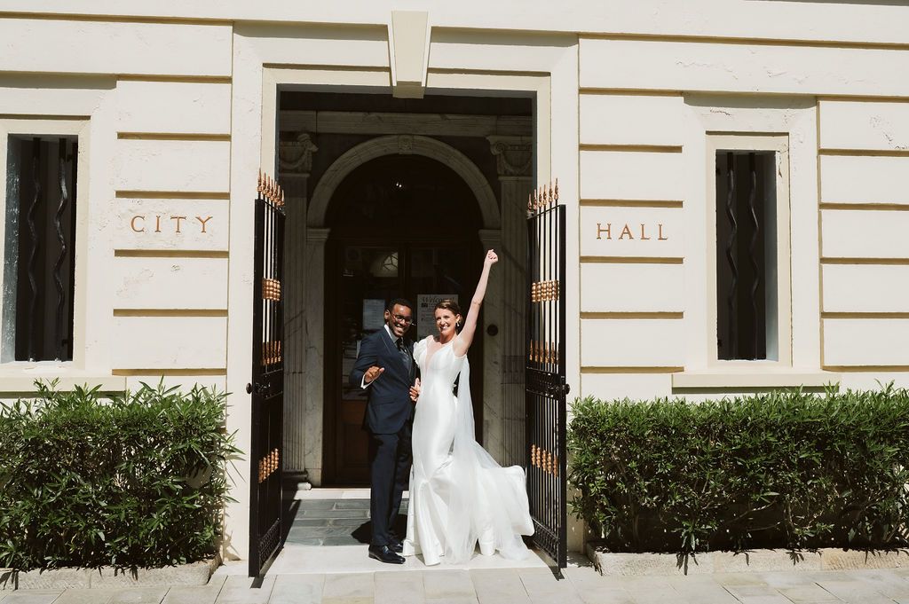 Bride celebrating after the ceremony at the registry office in Gibraltar