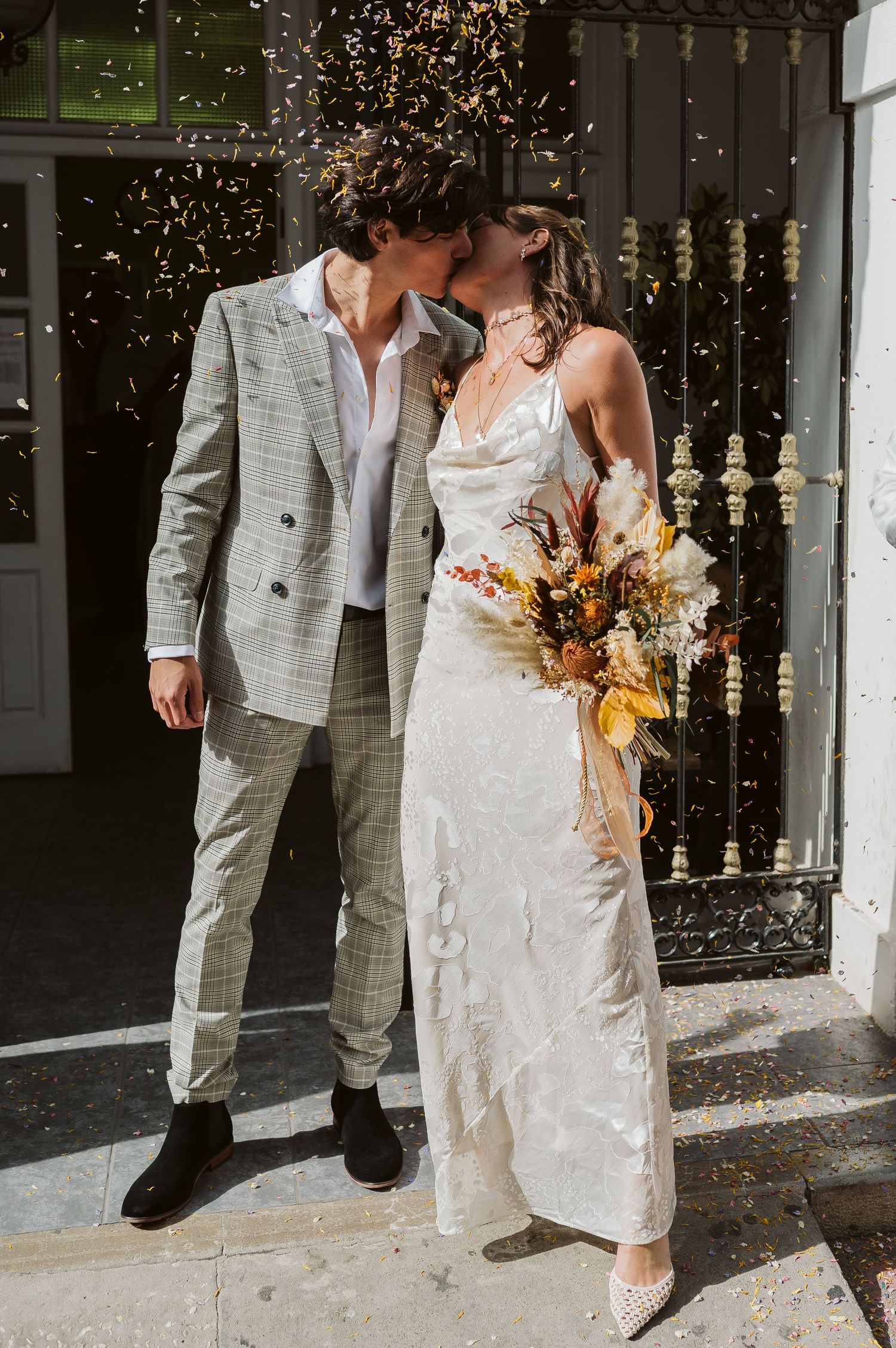 Bride and groom kissing after the ceremony