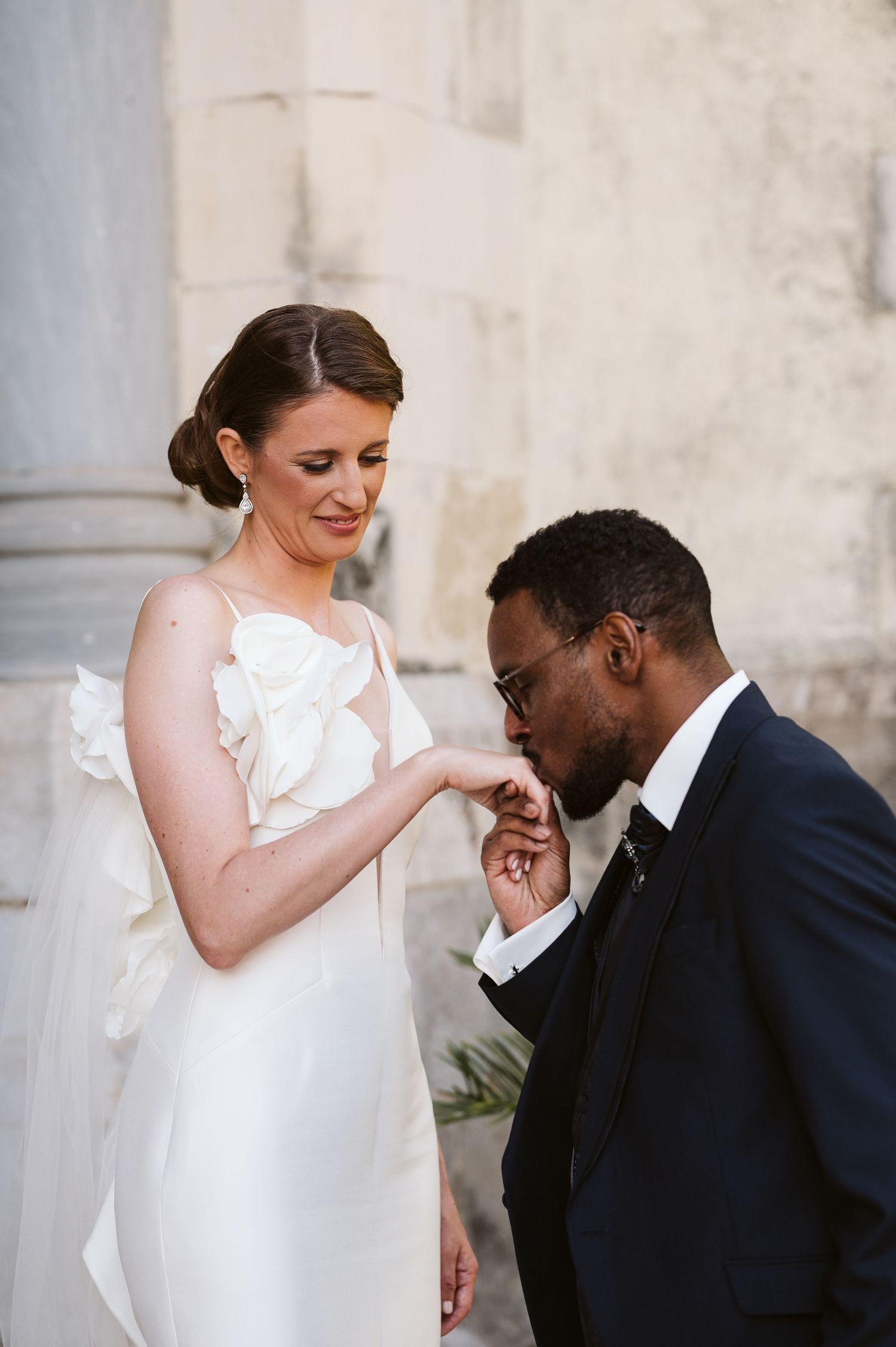Bride giving hand for a kiss at Gibraltar town