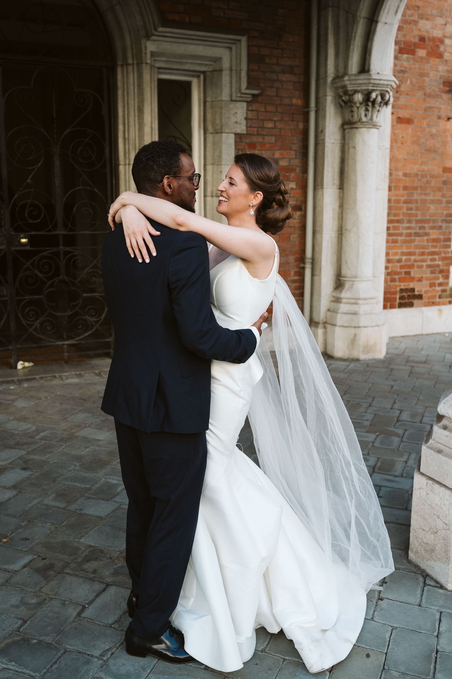 bride holding the groom by the neck at the Convent