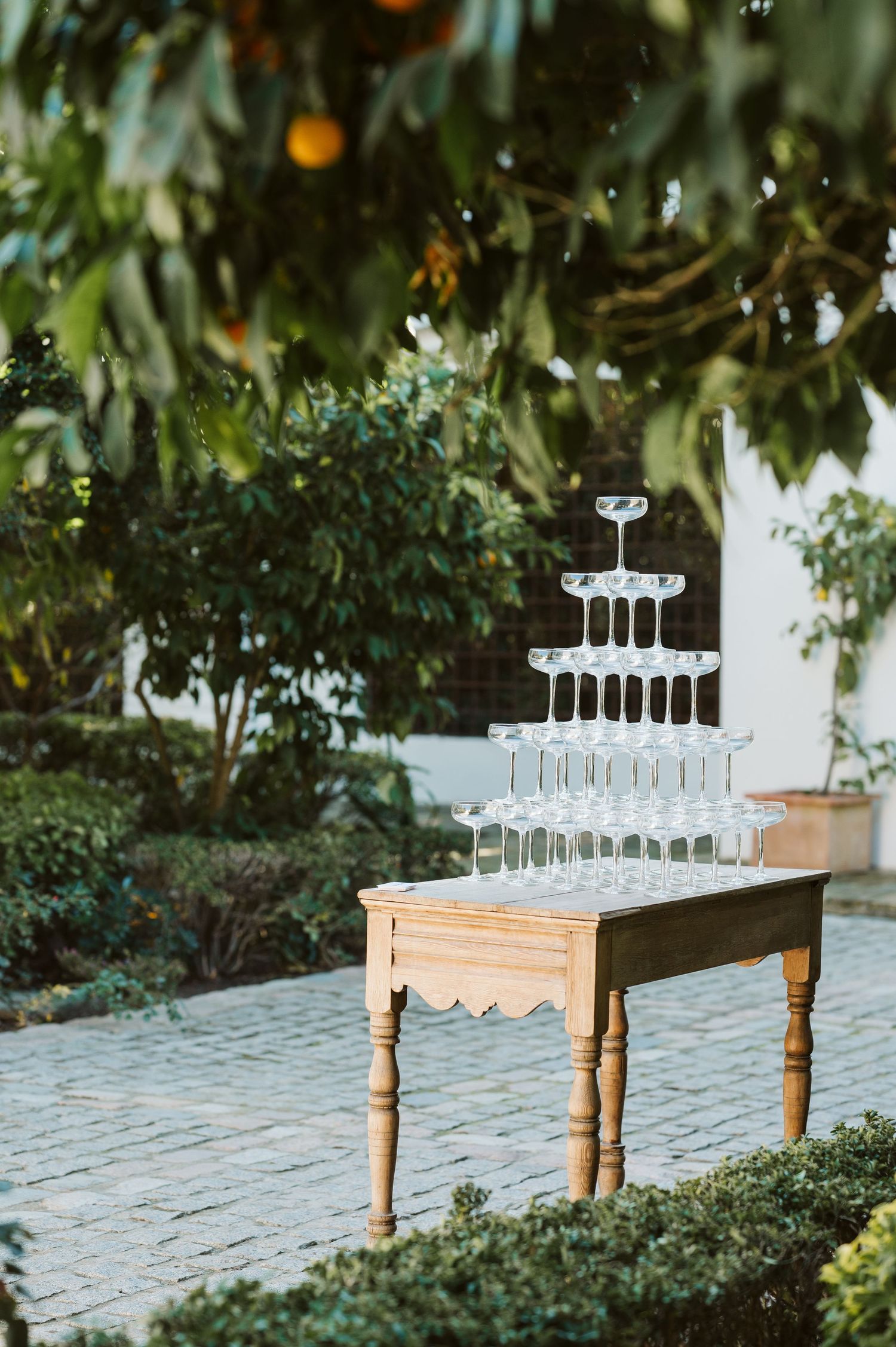 Champagne glasses stack together on a table