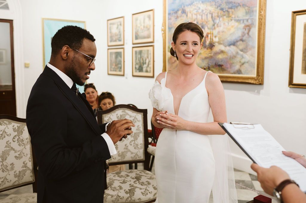 bride and groom ready to put the rings at the City Hall