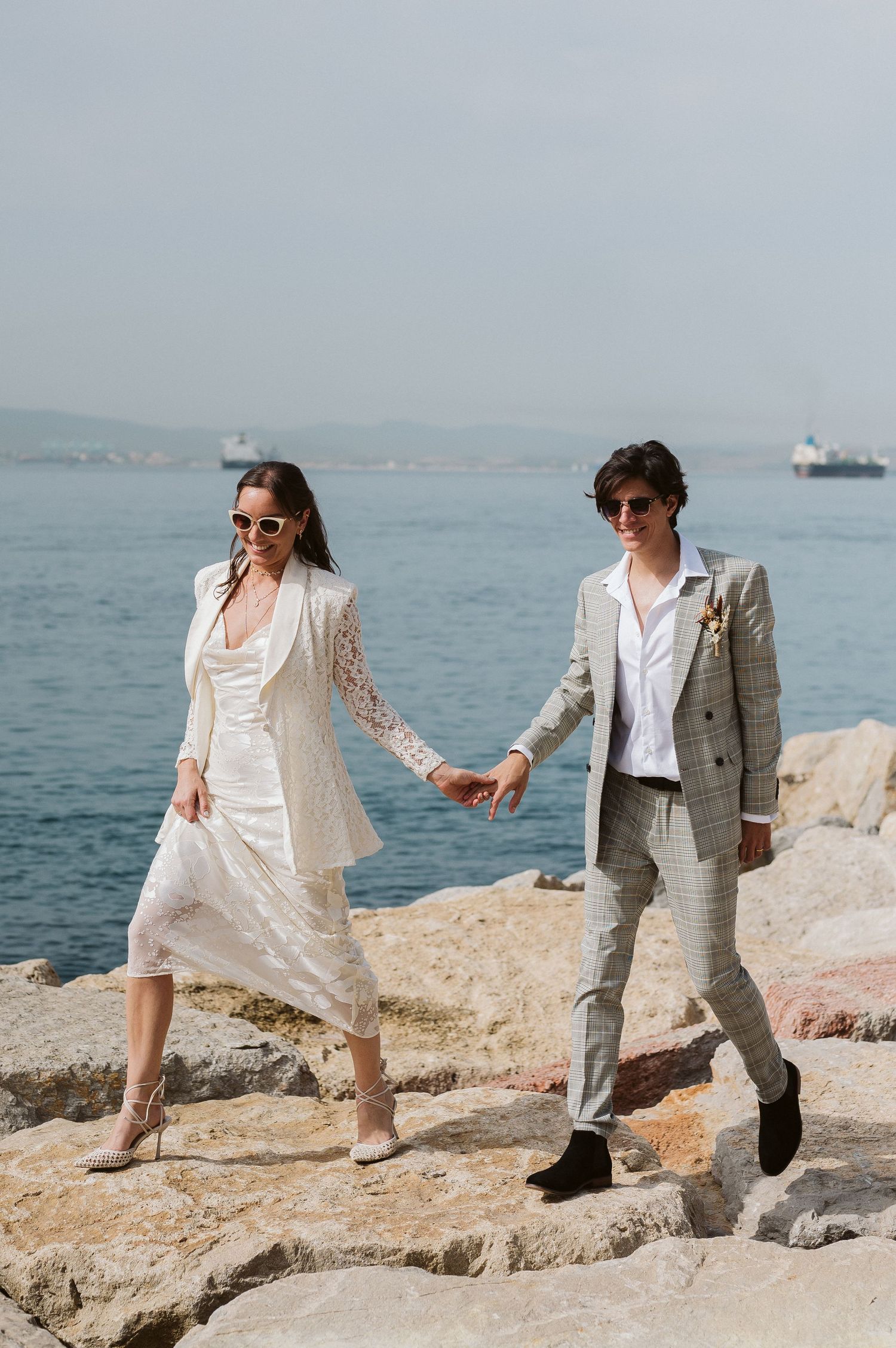 Bride and Groom walking in camp bay