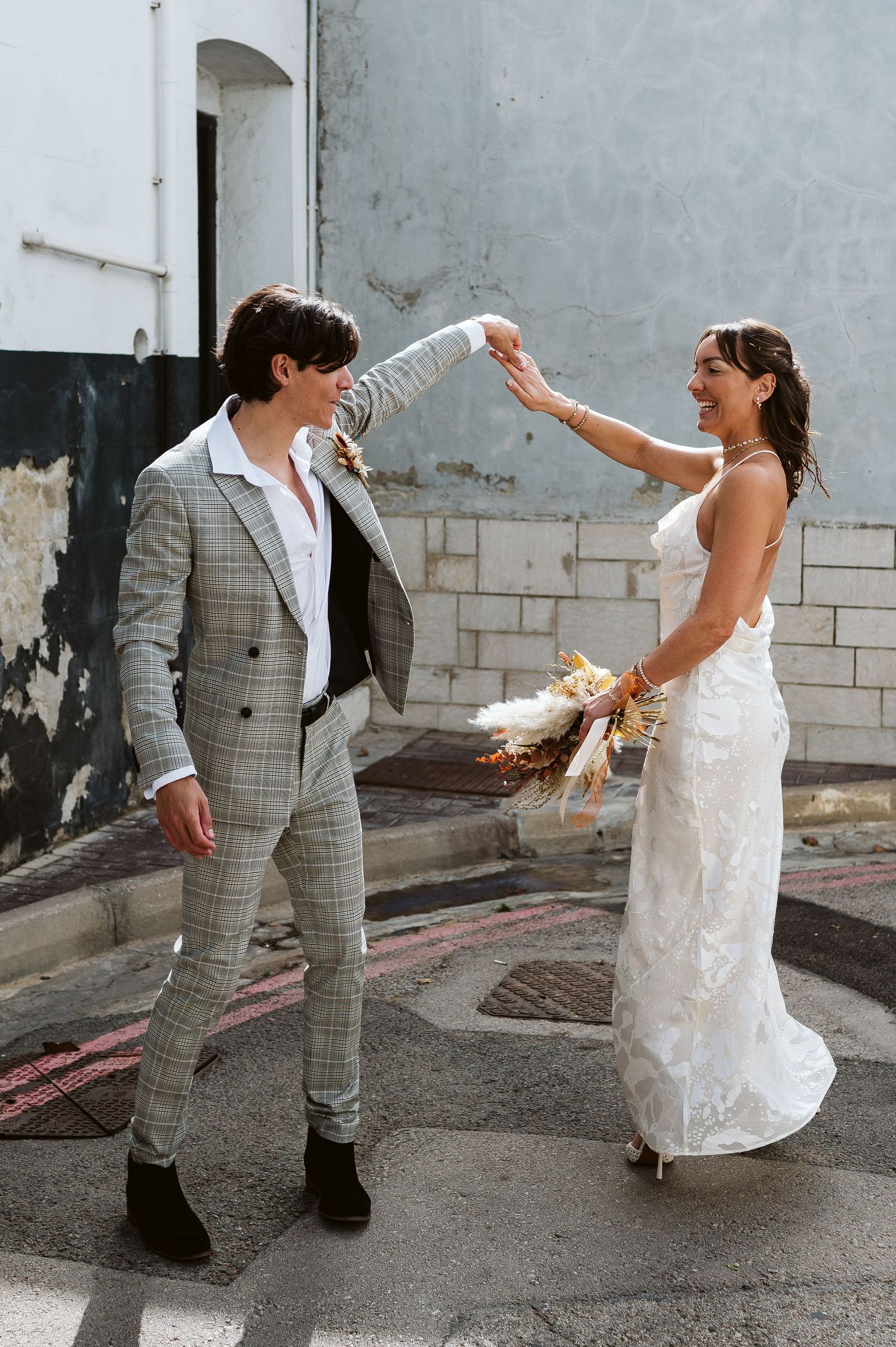 Groomn and bride dancing after the ceremony at the Registry office in Gibraltar