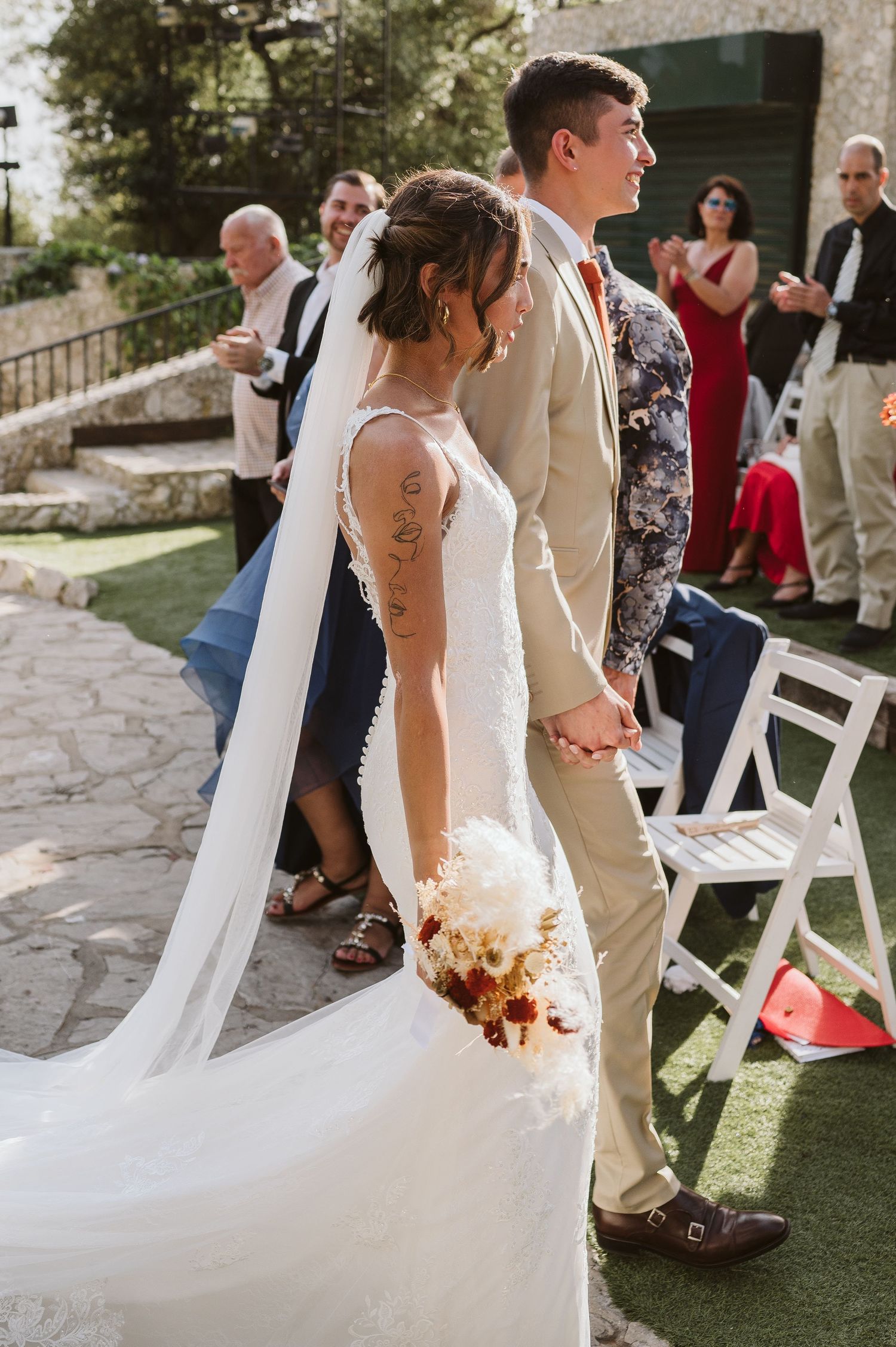 bride and groom walking down the aisle at Open air Theatre in Gibraltar