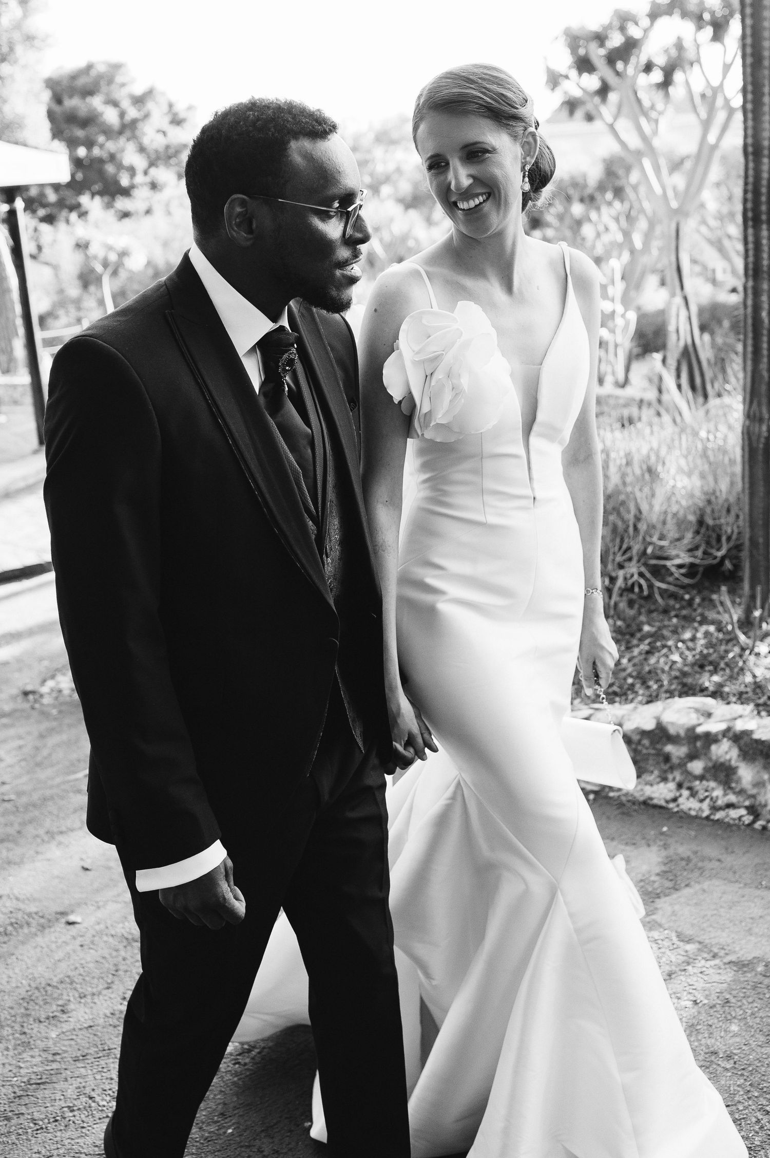 Bride and groom walking in Alameda Gardens