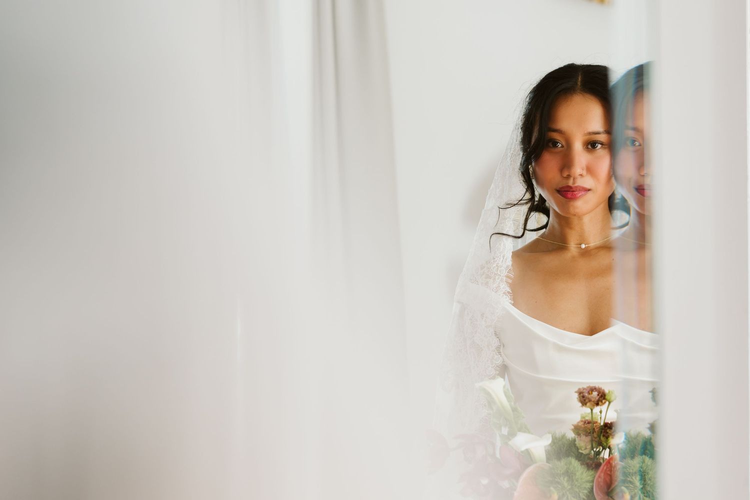 Bride looking into the mirror at Las sirenas