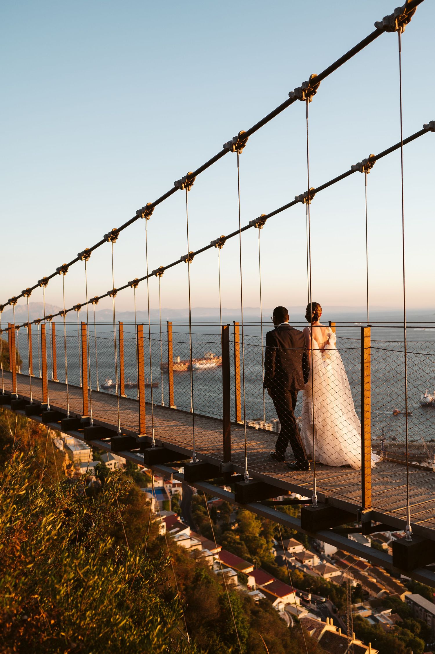 suspension bridge wedding couple walking
