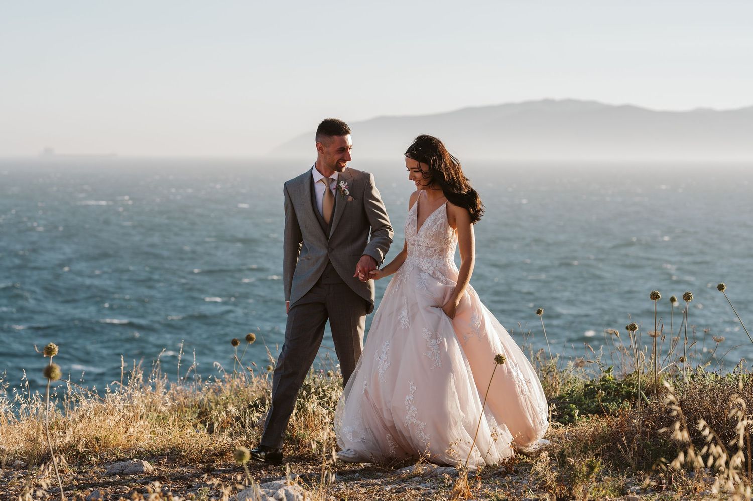 Bride and groom walking in Gibraltar