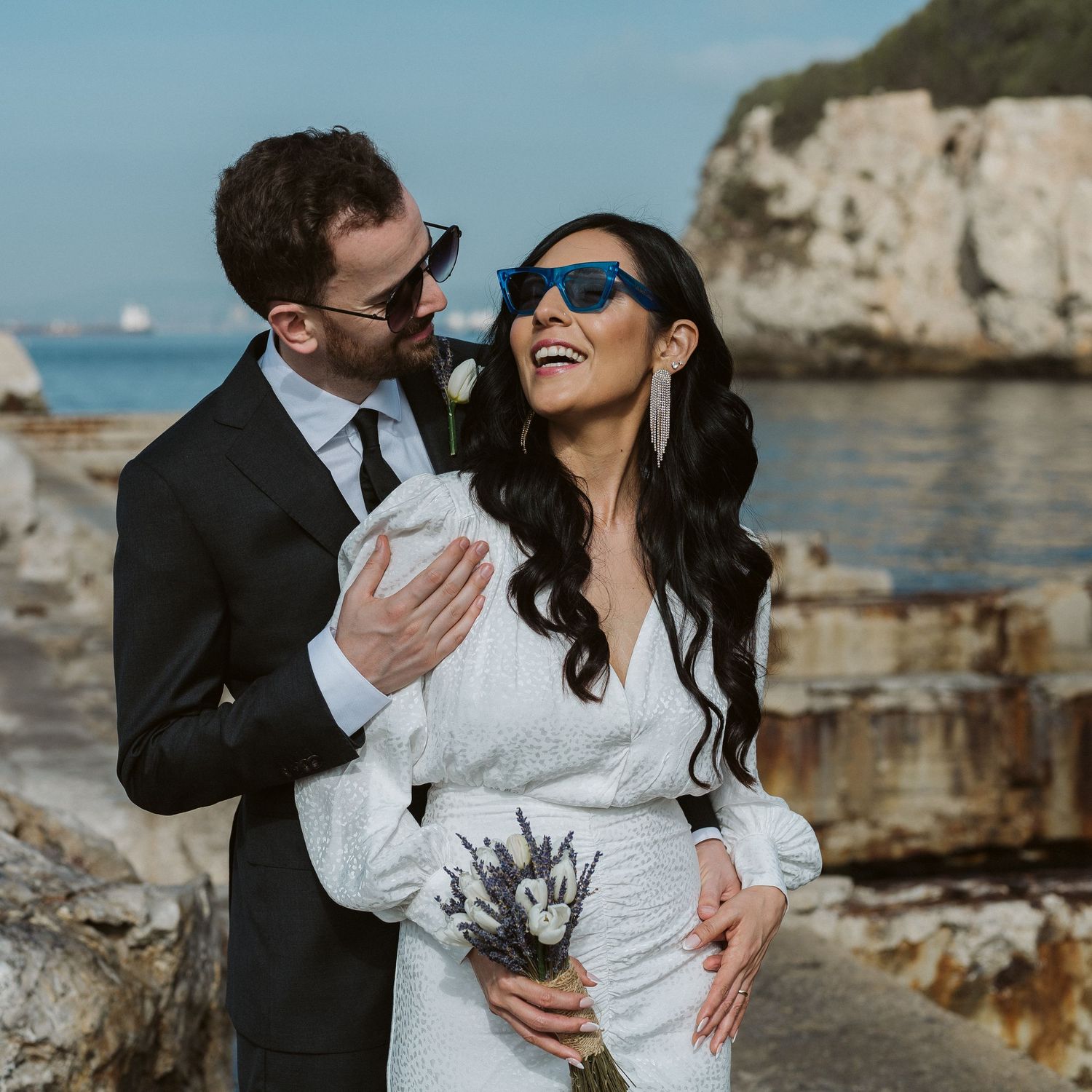 Bride laughing at Rosia Bay