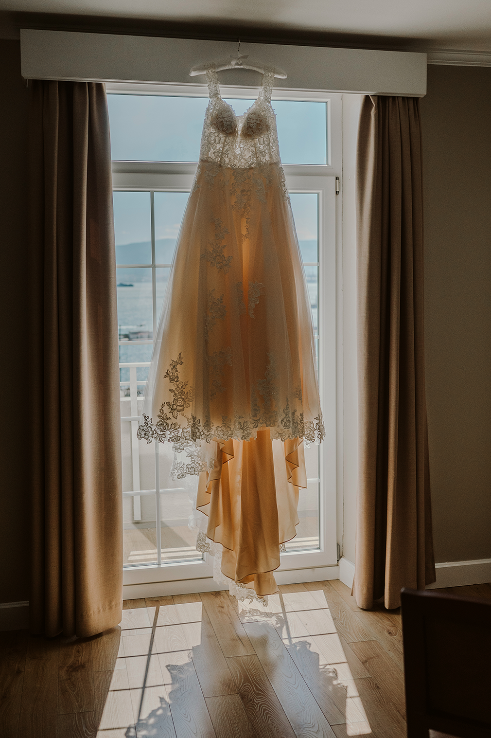Wedding dress hanging on the window