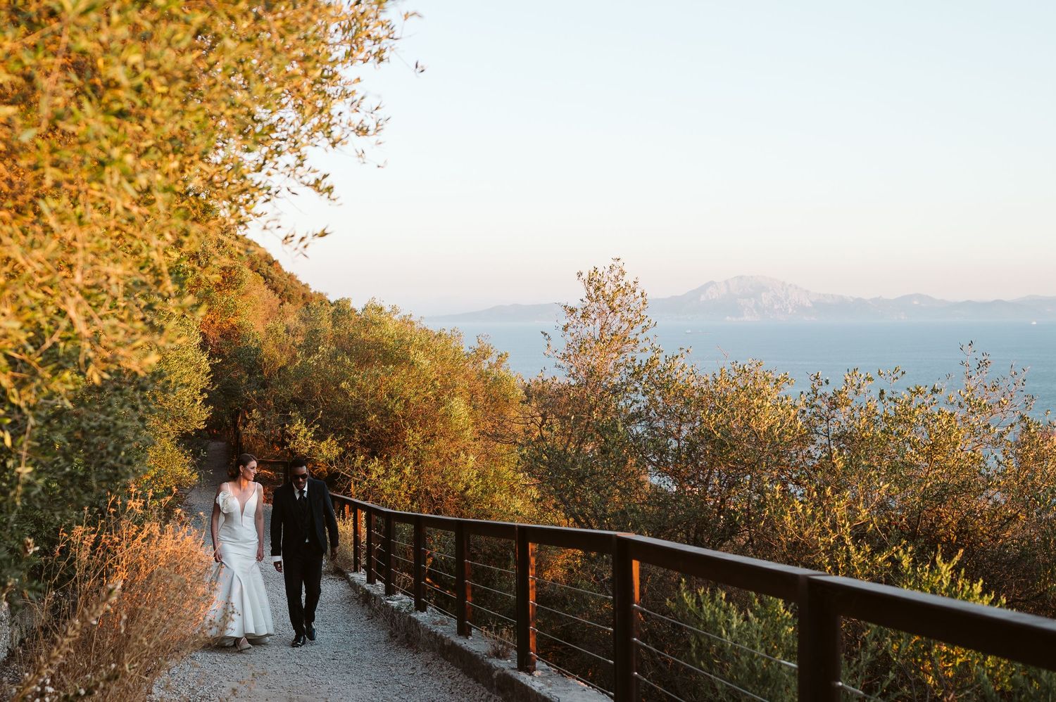 Wedding couple walking on top of the Rock with beautiful views