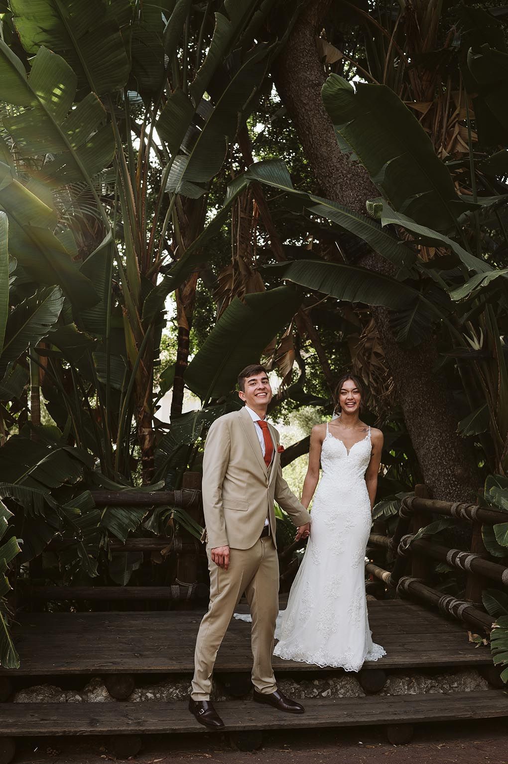 groom and bride laughing at the camera at the Alameda Gardens