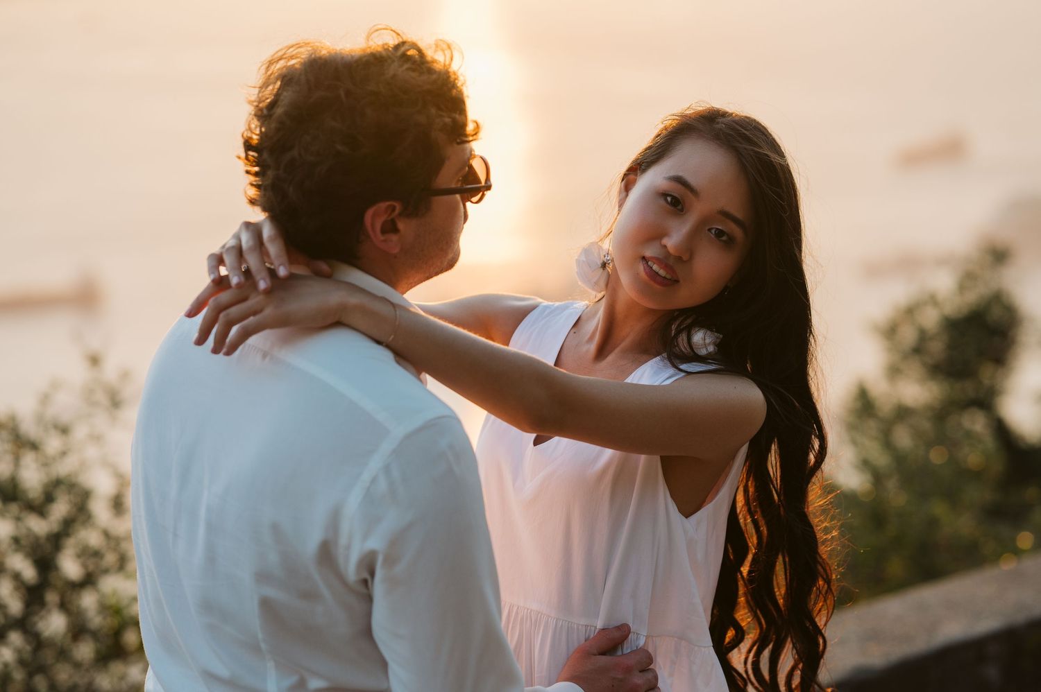 Bride at the sunset looking at the camera