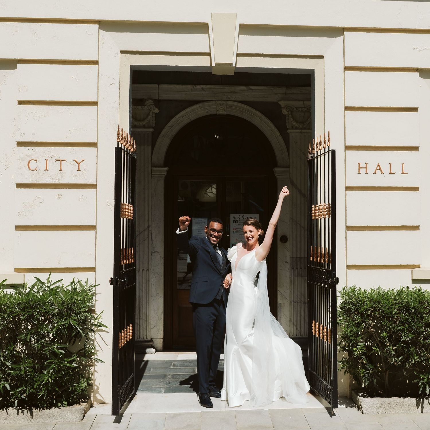 Bride and groom celebrating at the City Hall straight after the ceremony