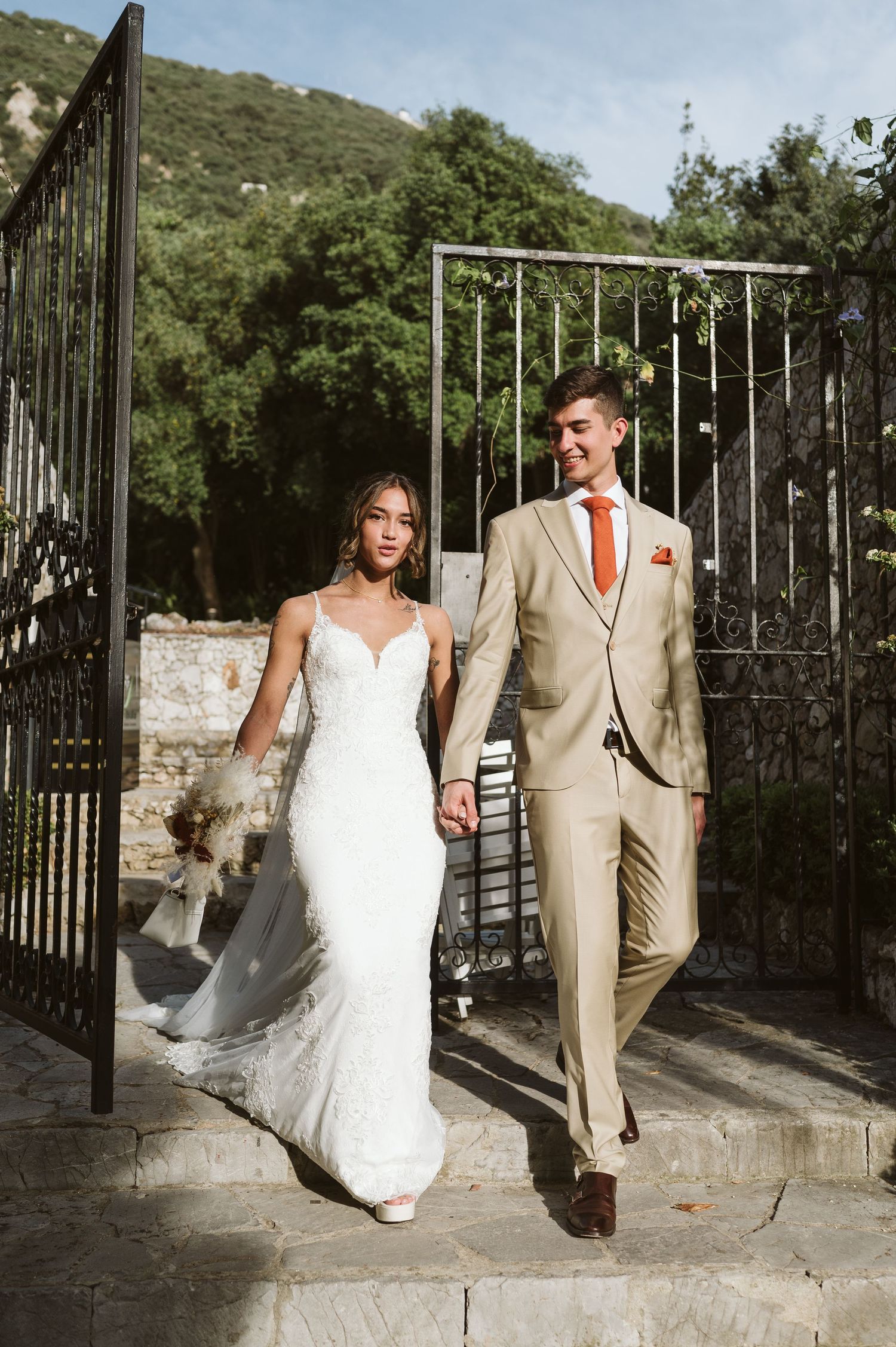 bride and groom walking out from the Open Air Theatre in Gibraltar