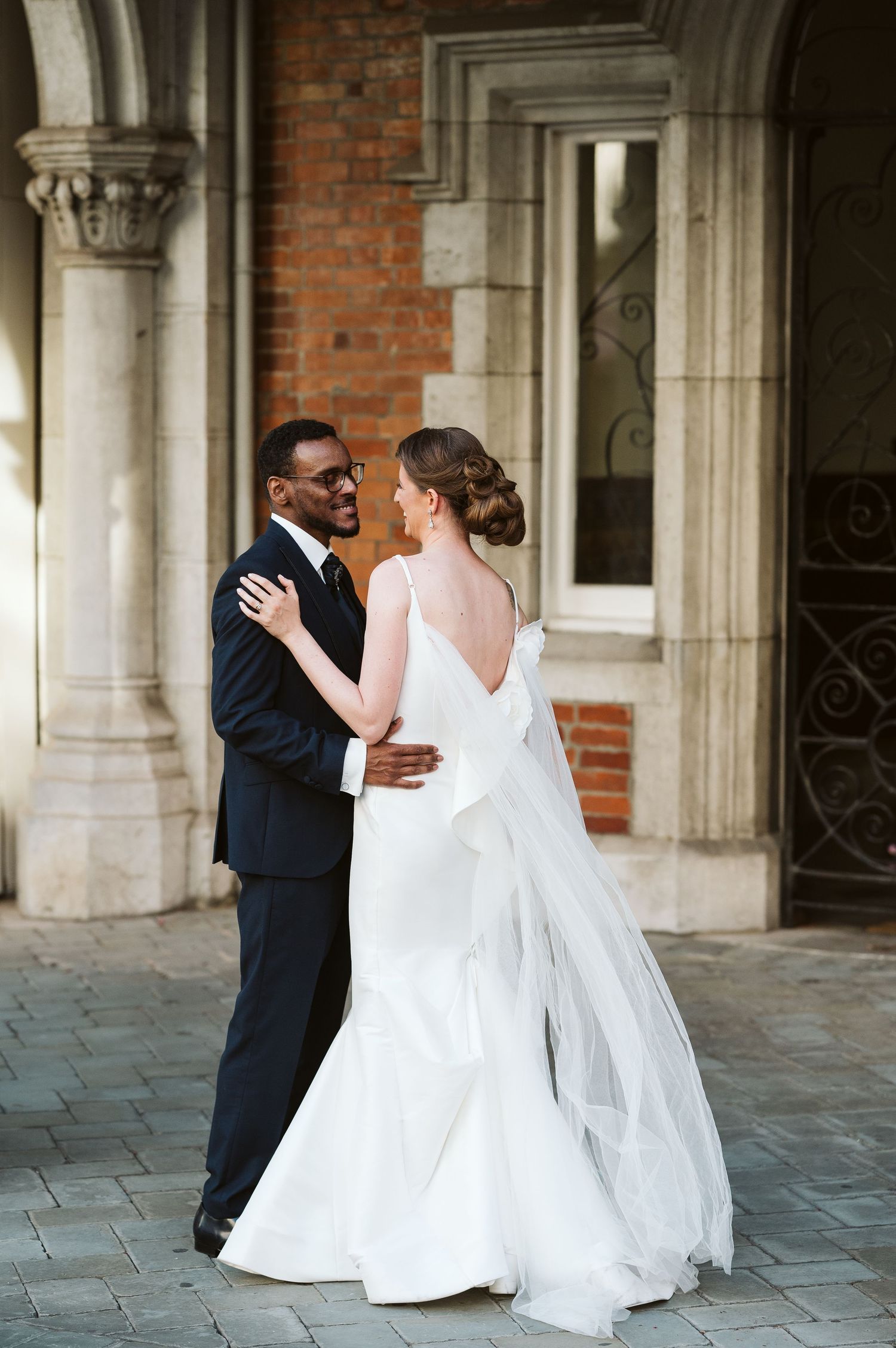 bride and groom holding tight at the Convent