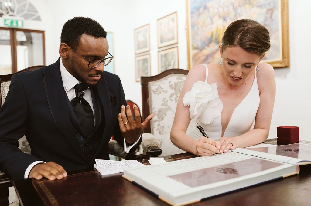 bride signing the registry book