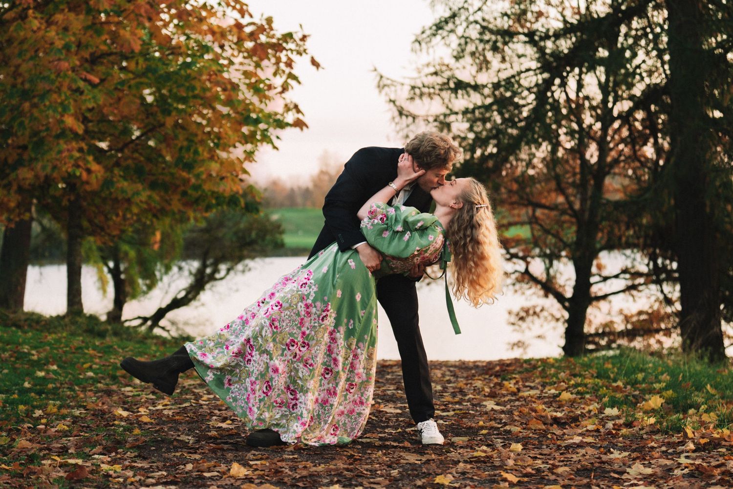 Couple in autumn forest sharing romantic moments in a series of connected artistic photographs near a lake.