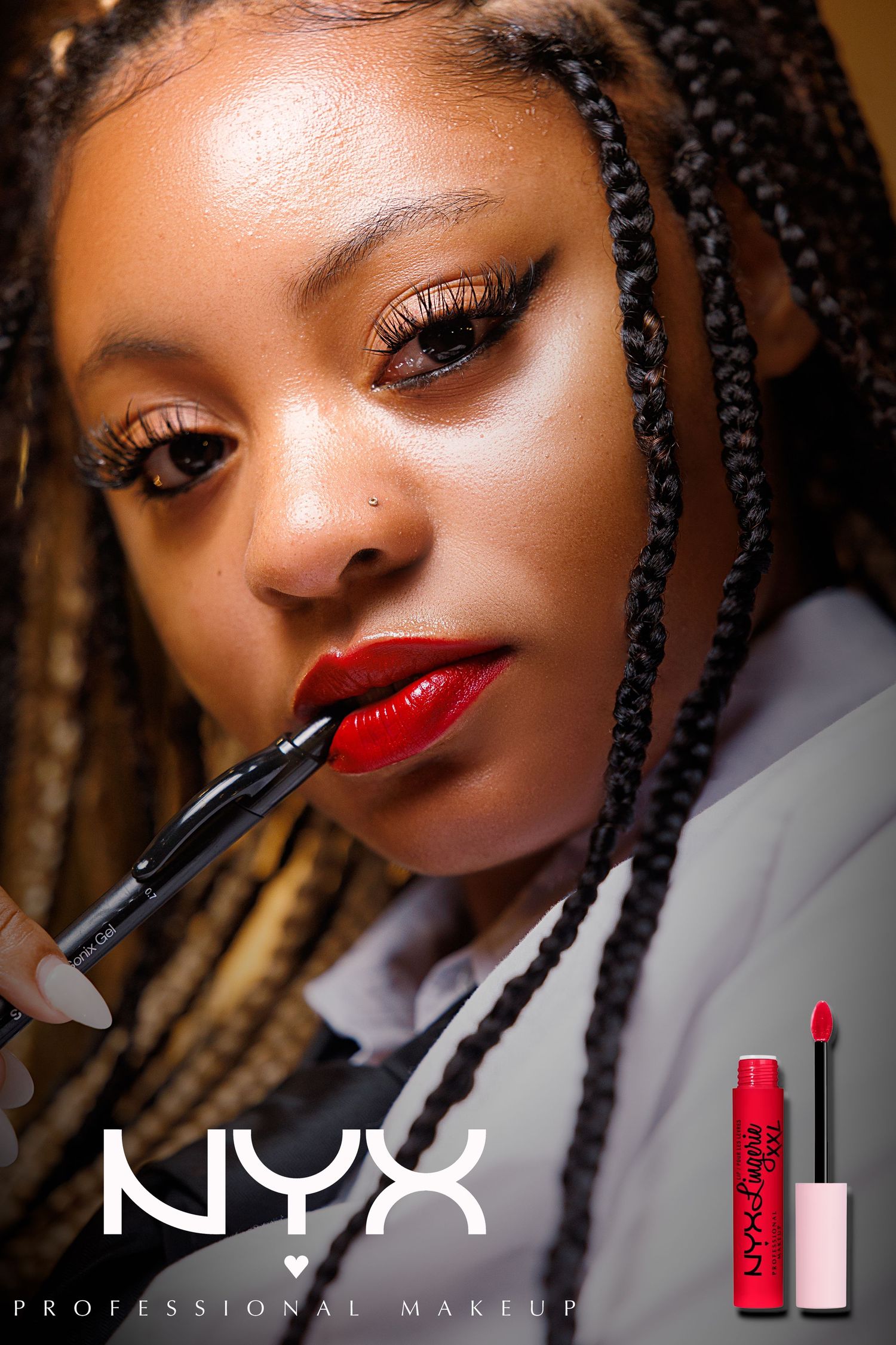 NYX Professional Makeup ad featuring a model applying bold red liquid lipstick with a brush, wearing box braids.