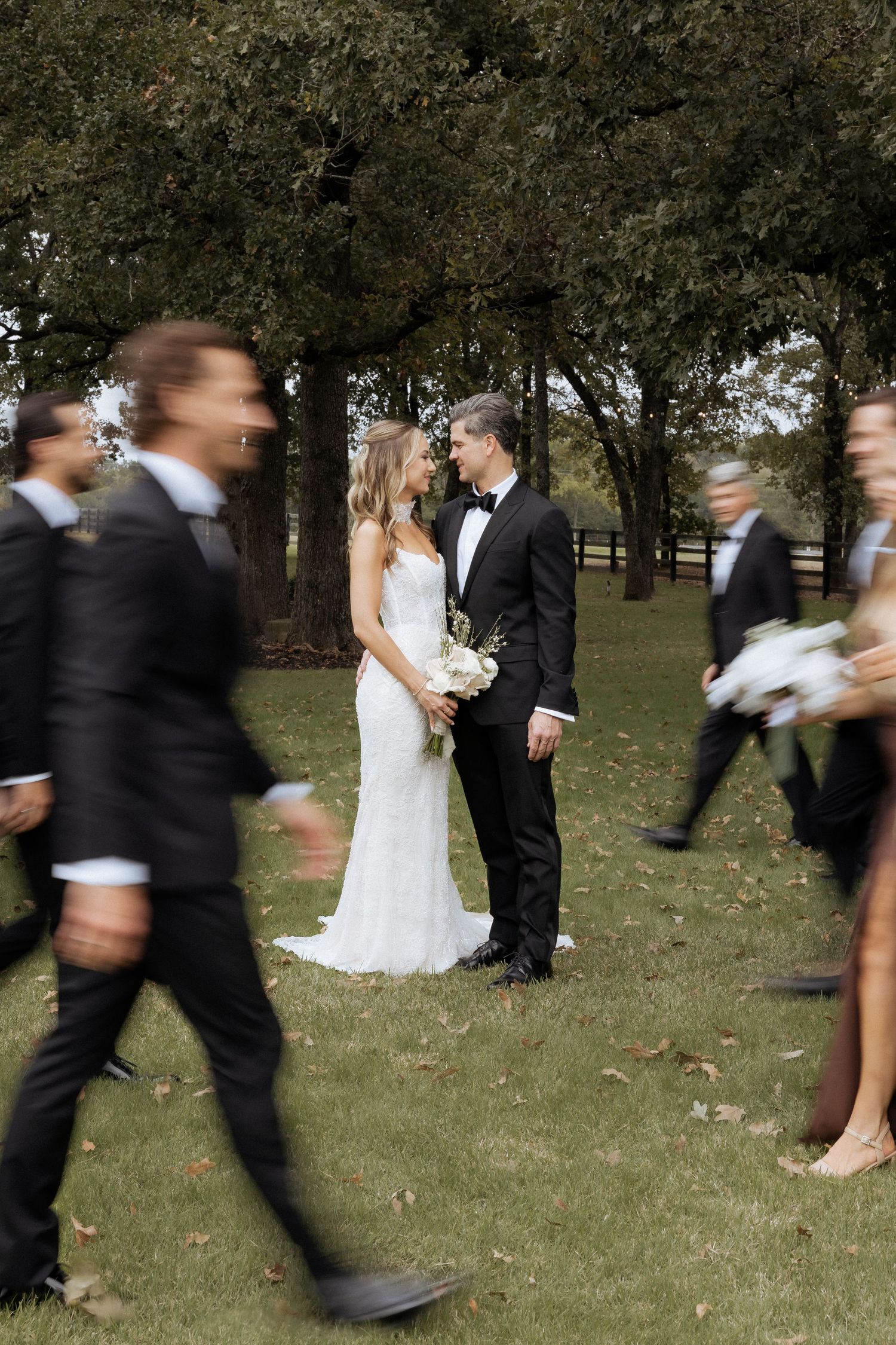 A sequence of wedding photos showing a couple and wedding party moving through a playful dance routine outdoors.