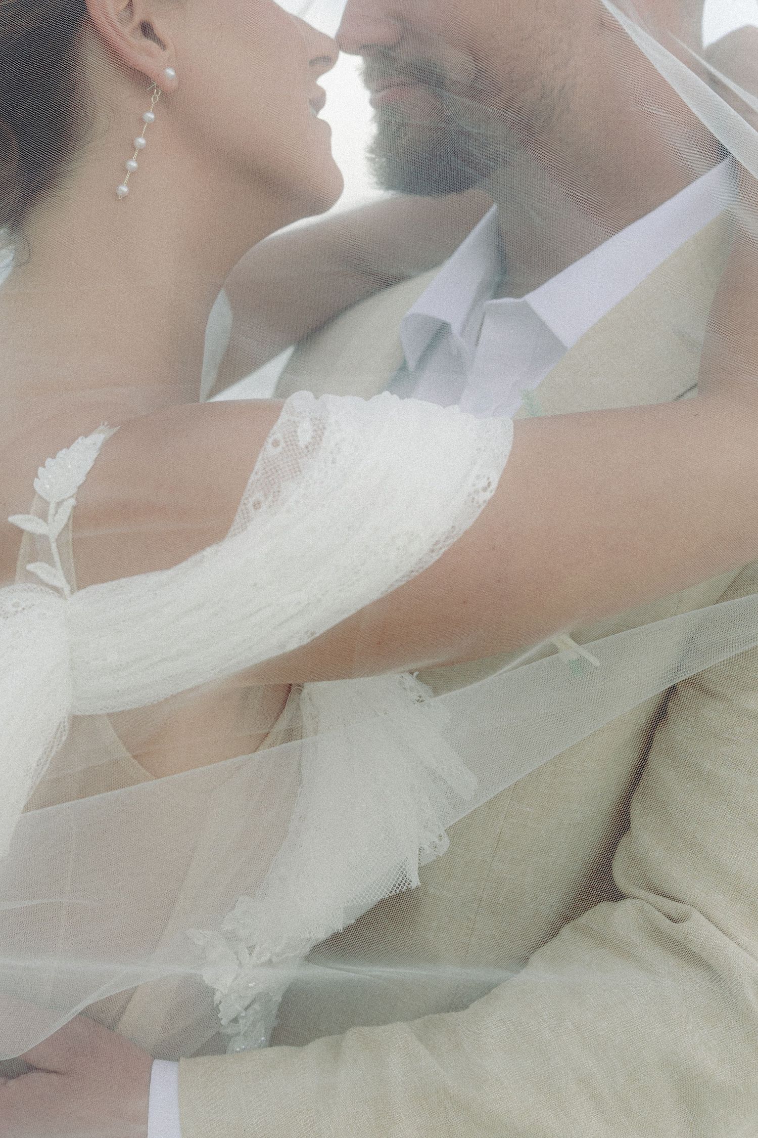 A series of romantic wedding photos showing a couple in elegant white attire sharing intimate moments.