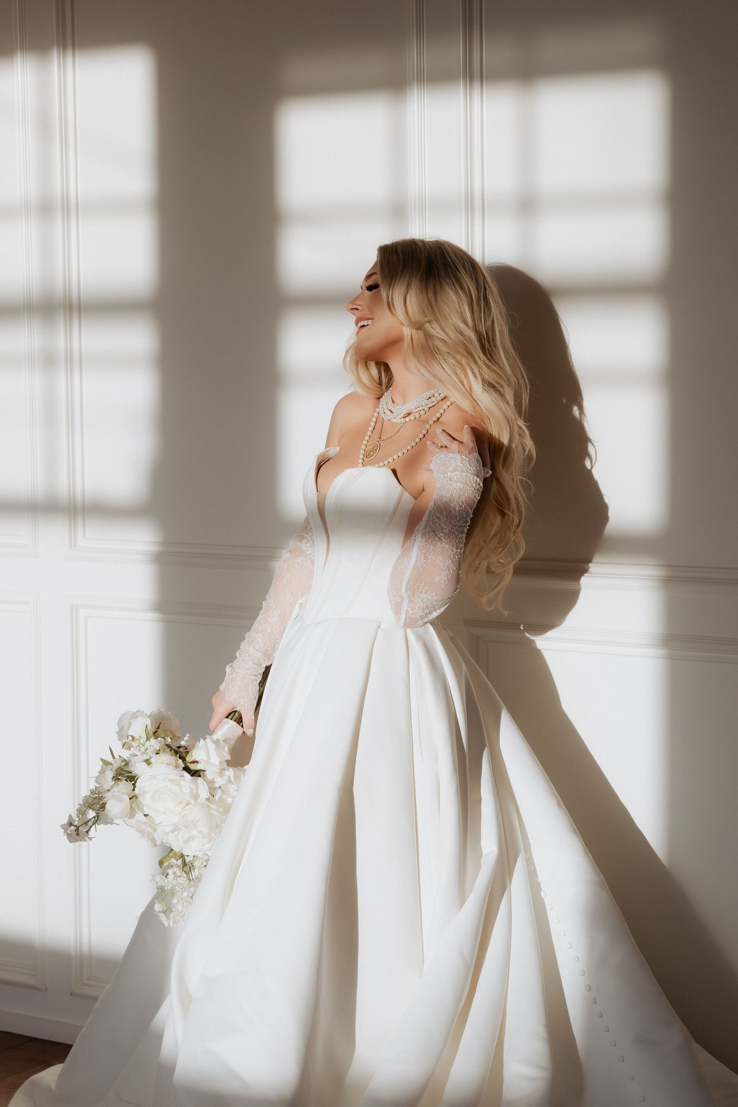 Artistic portrait series showing a person in white clothing against sunlit walls creating dramatic shadows and light patterns.