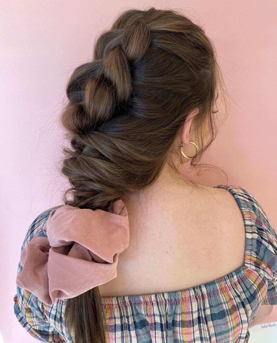 Step-by-step hair styling sequence showing the creation of a casual braided hairstyle from behind.