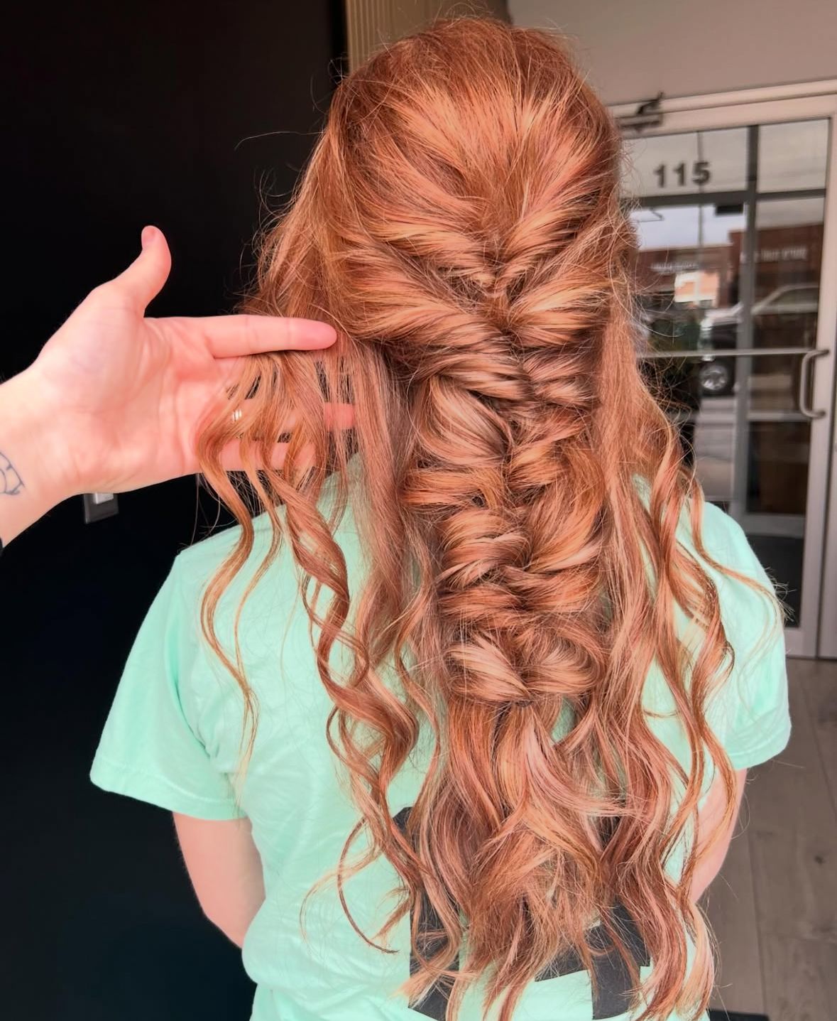 A series of hairstyling photos showing a French braid transformation with wavy copper-colored hair in a mint green top.