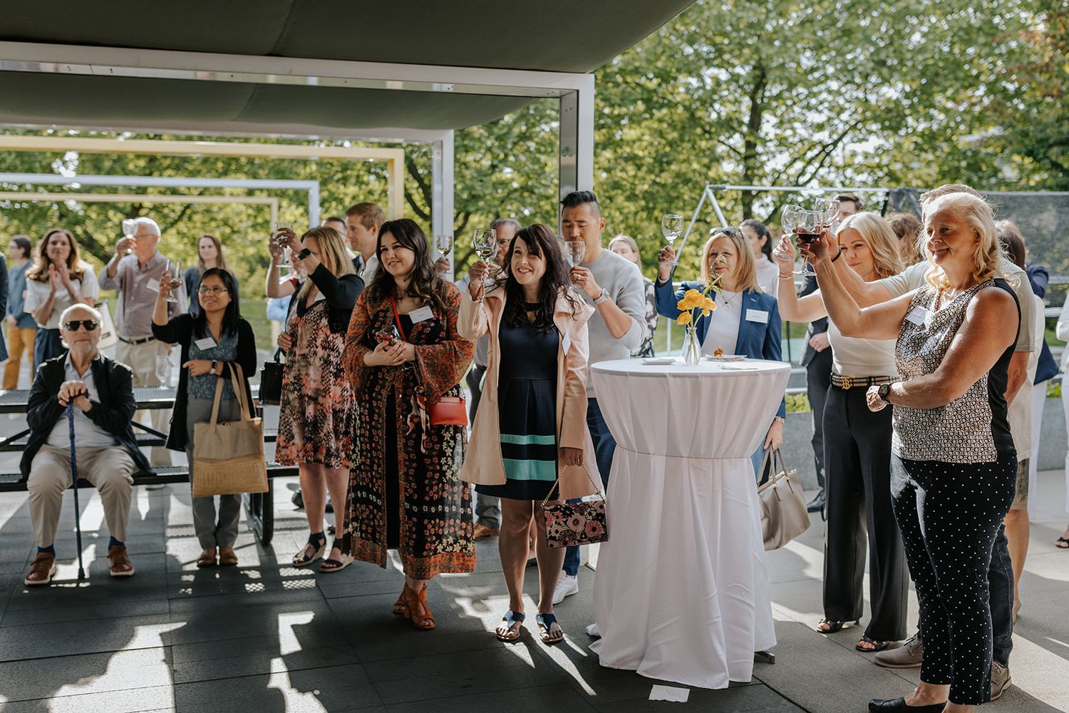 Guests gather outside a venue entrance for a celebration.