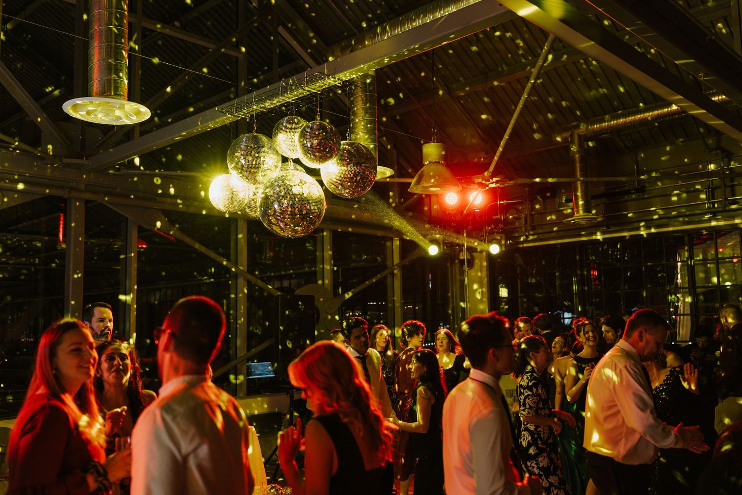 Dimly lit dance floor with hanging lights creating a magical starlit atmosphere for celebration.