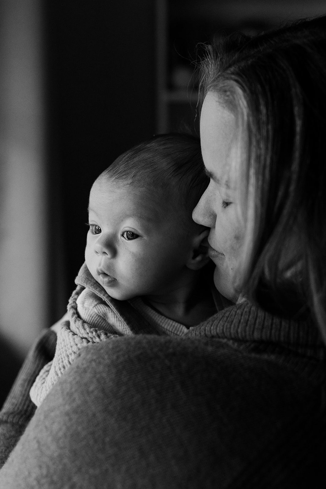 Intimate black and white portraits of parent and child bonding moments.