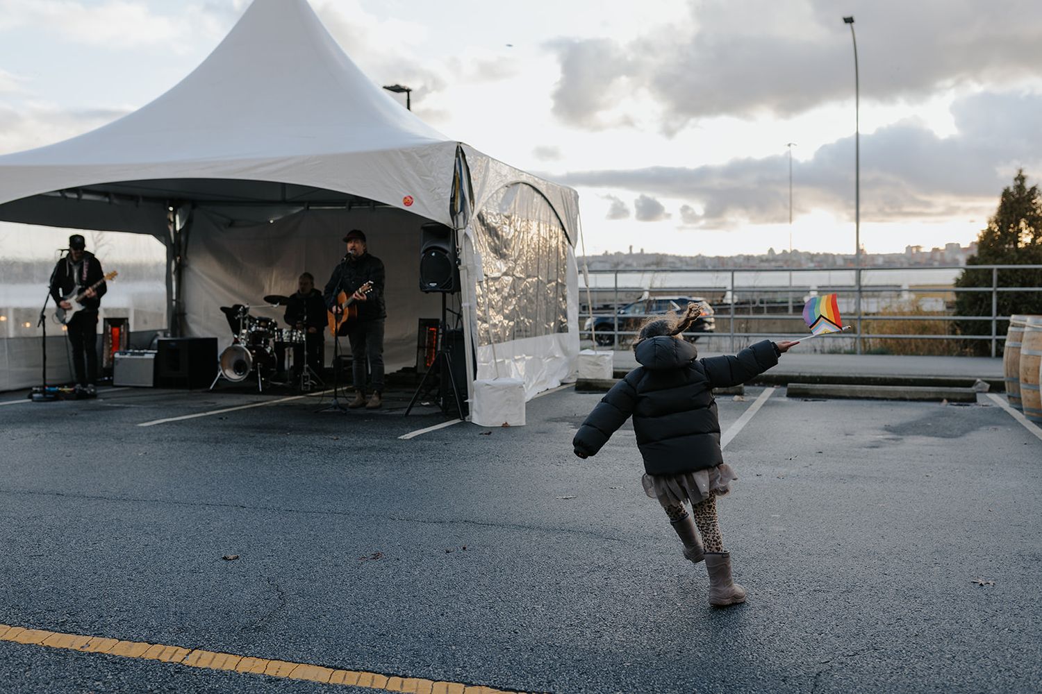 Skateboarding sequence under white tent canopy at sunset.