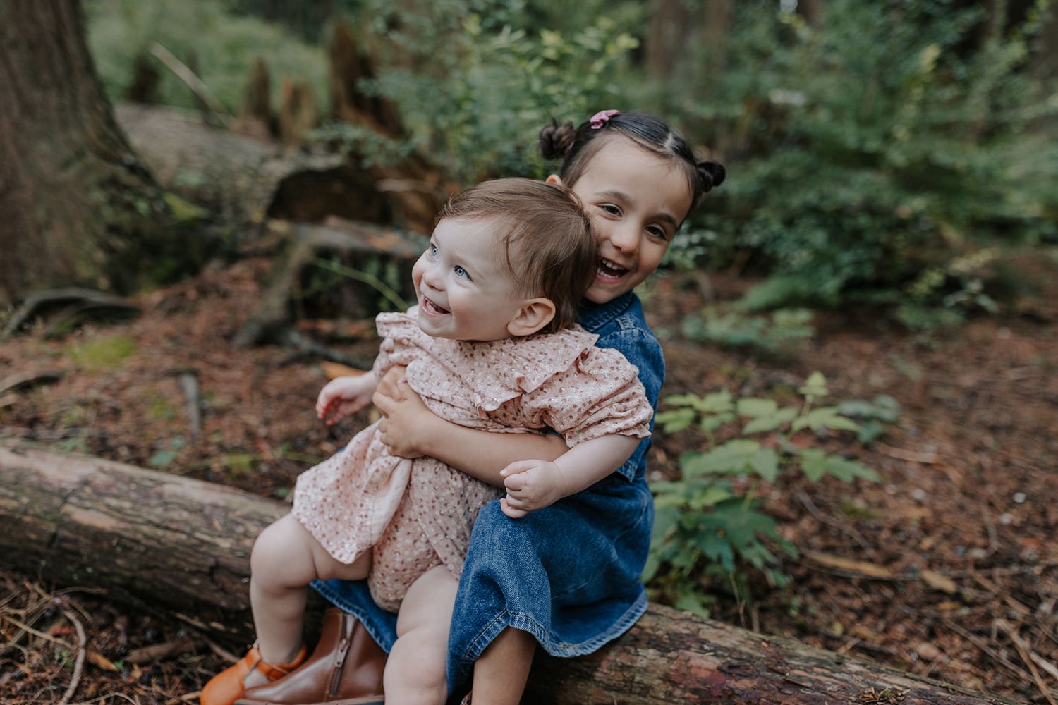 Tender family moments captured in sequence while playing in a forest setting.