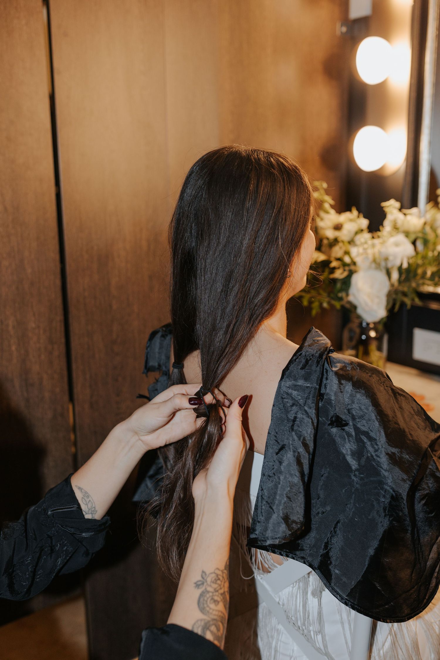 Behind-the-scenes sequence of hair styling preparation in a dressing room.