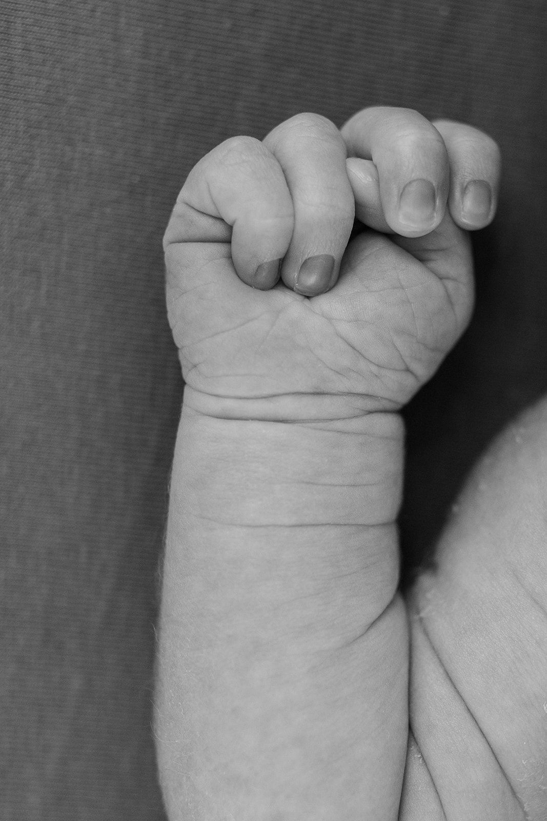 Close-up series of a tiny baby's wrinkled foot showing delicate details.