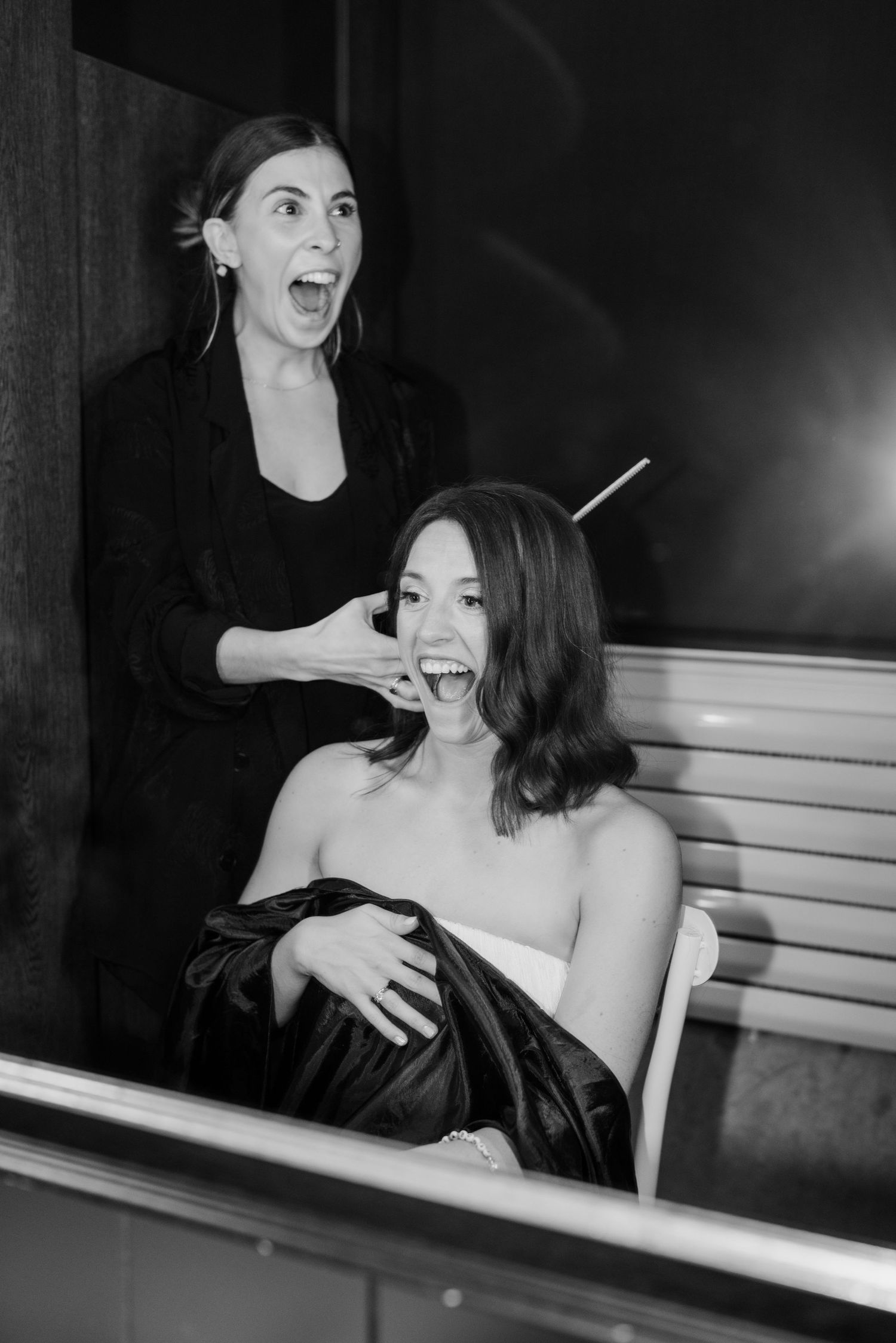 Black and white candid party photos showing people laughing and enjoying themselves on a bench.