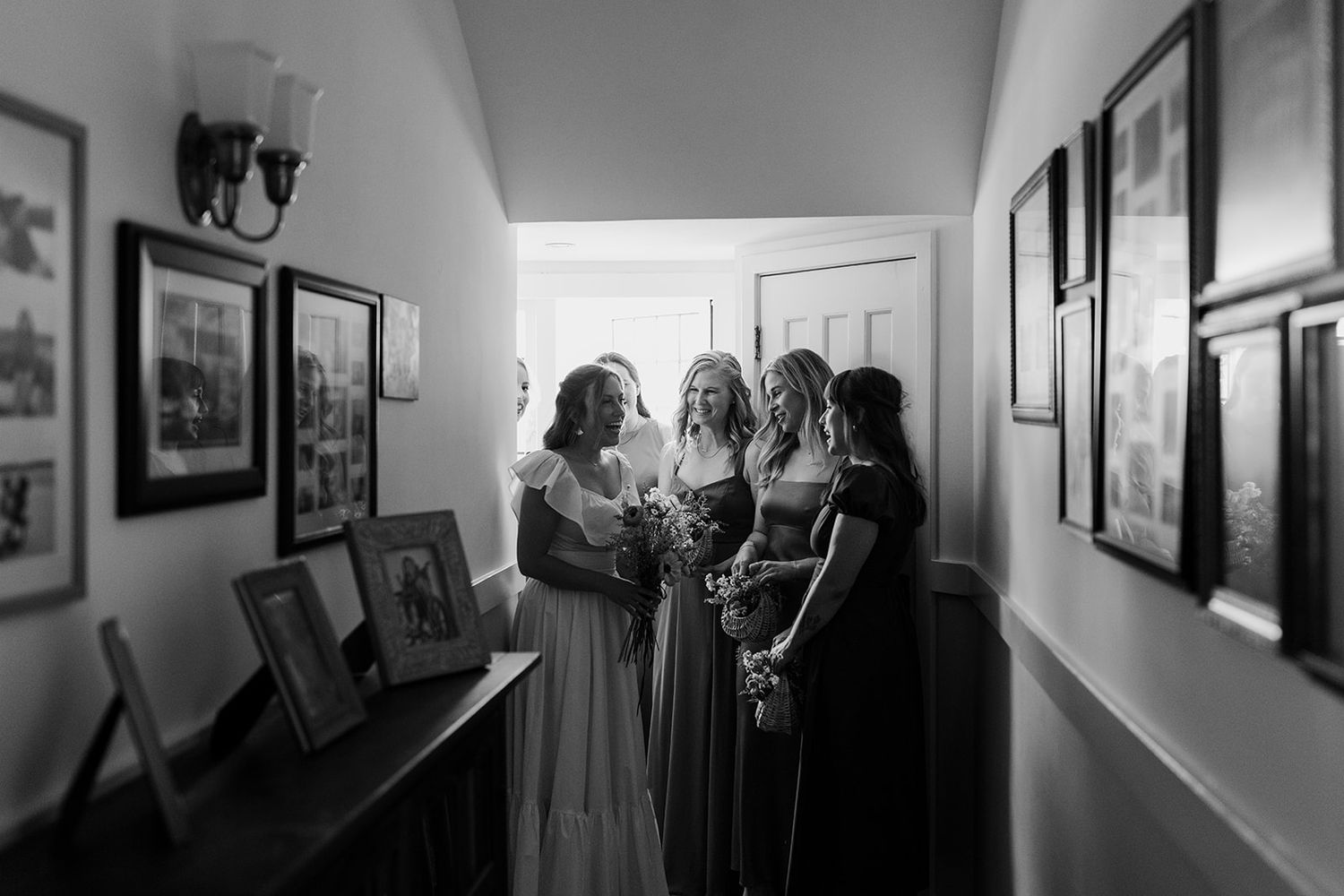 Black and white hallway interior shots during wedding preparation.