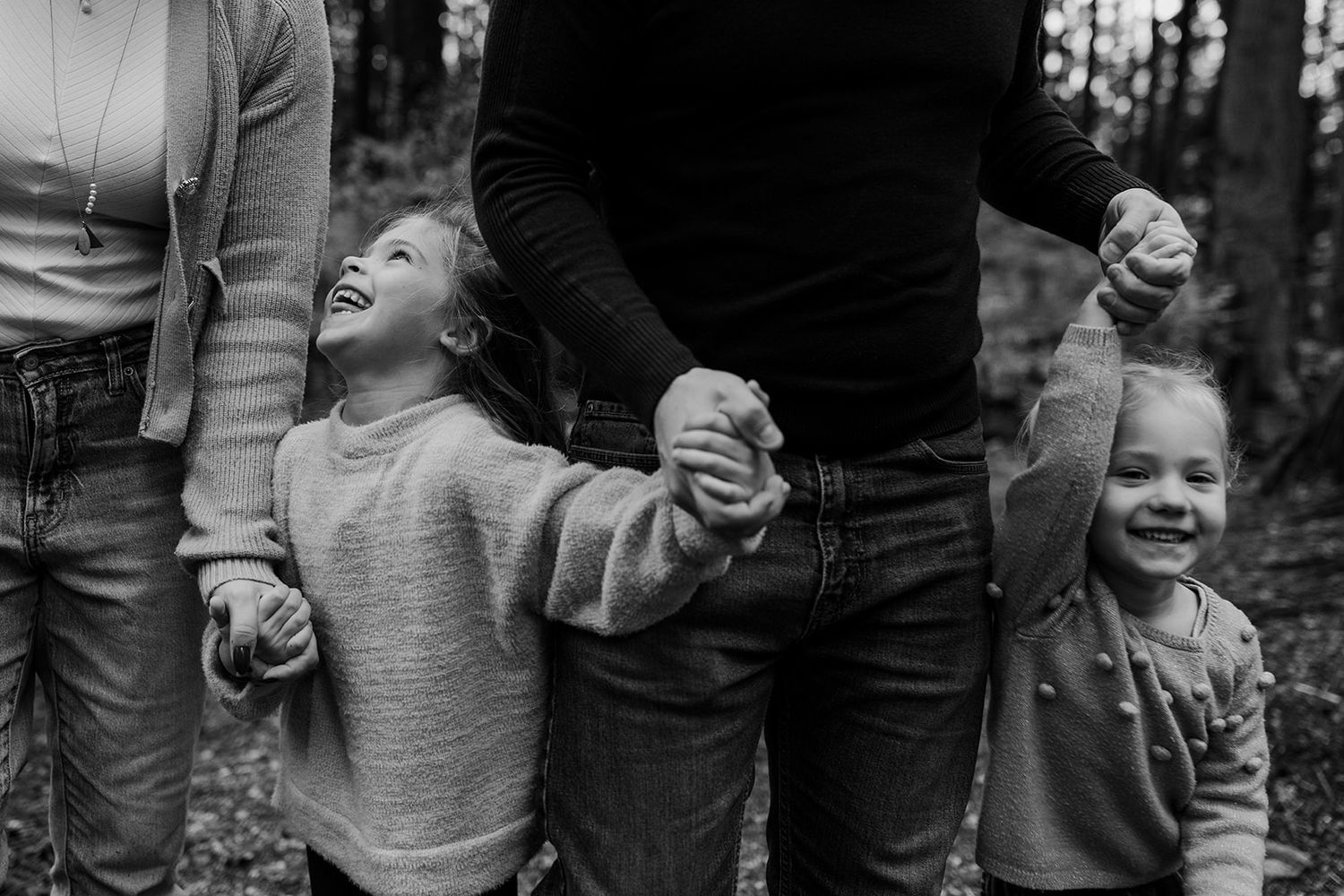 Black and white candid shots capturing joyful moments between family members.