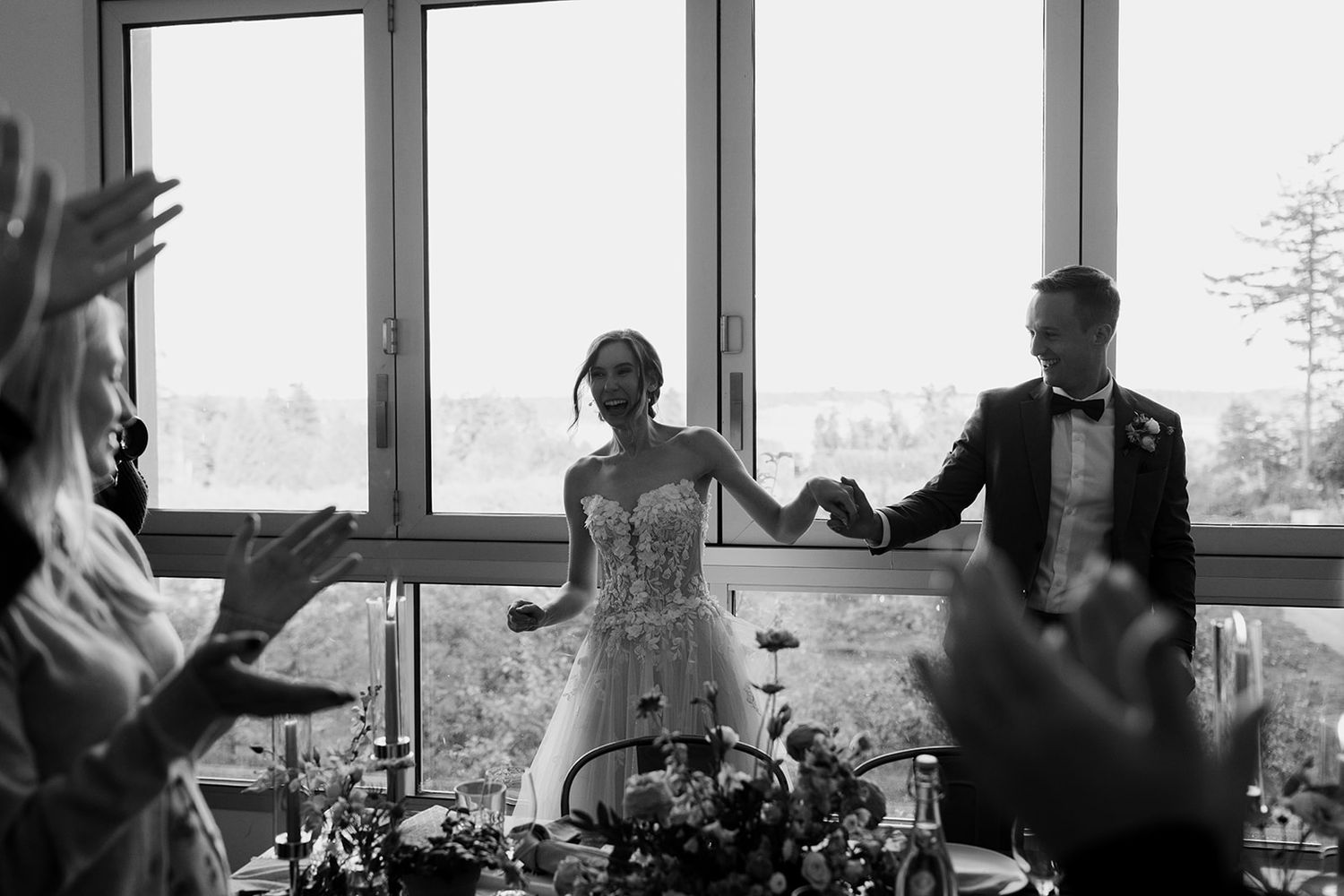 Black and white photos showing preparation moments through window frames.