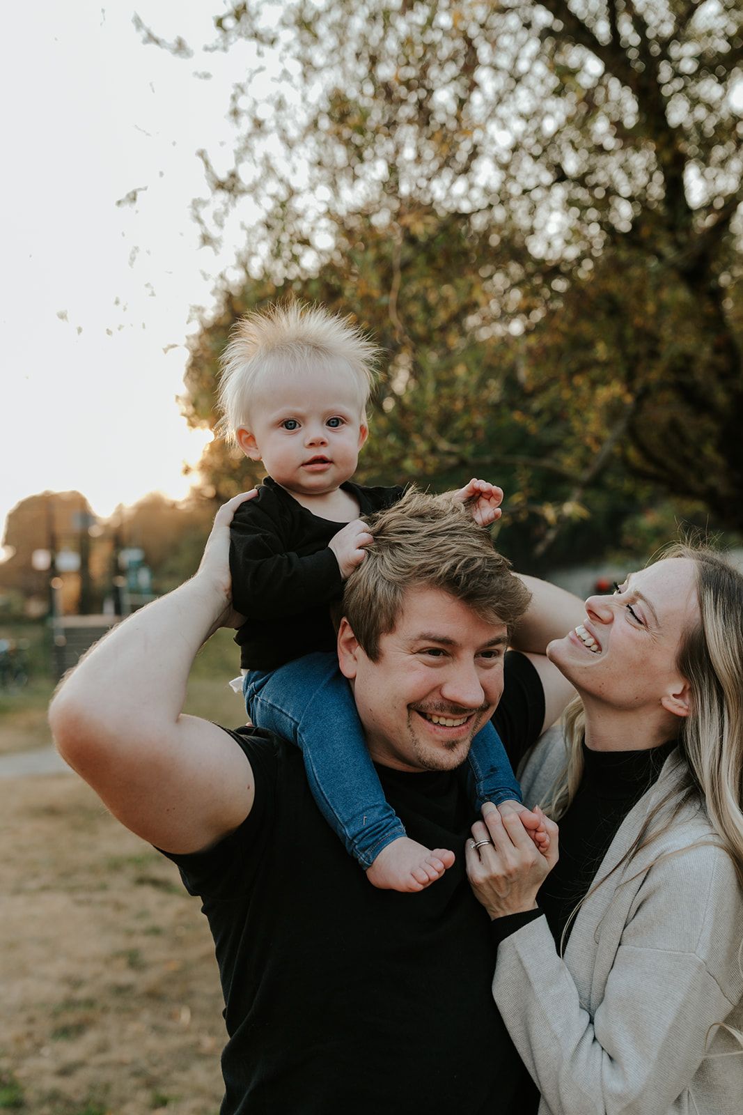 Candid family moments captured during sunset with playful expressions and laughter.