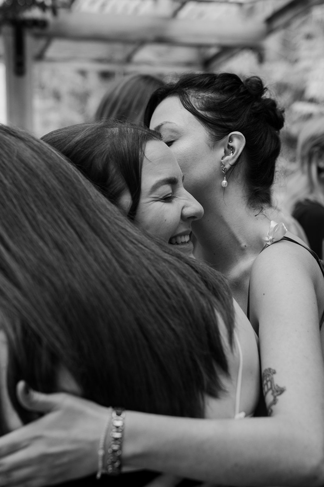 Intimate black and white moment captured during wedding celebration.