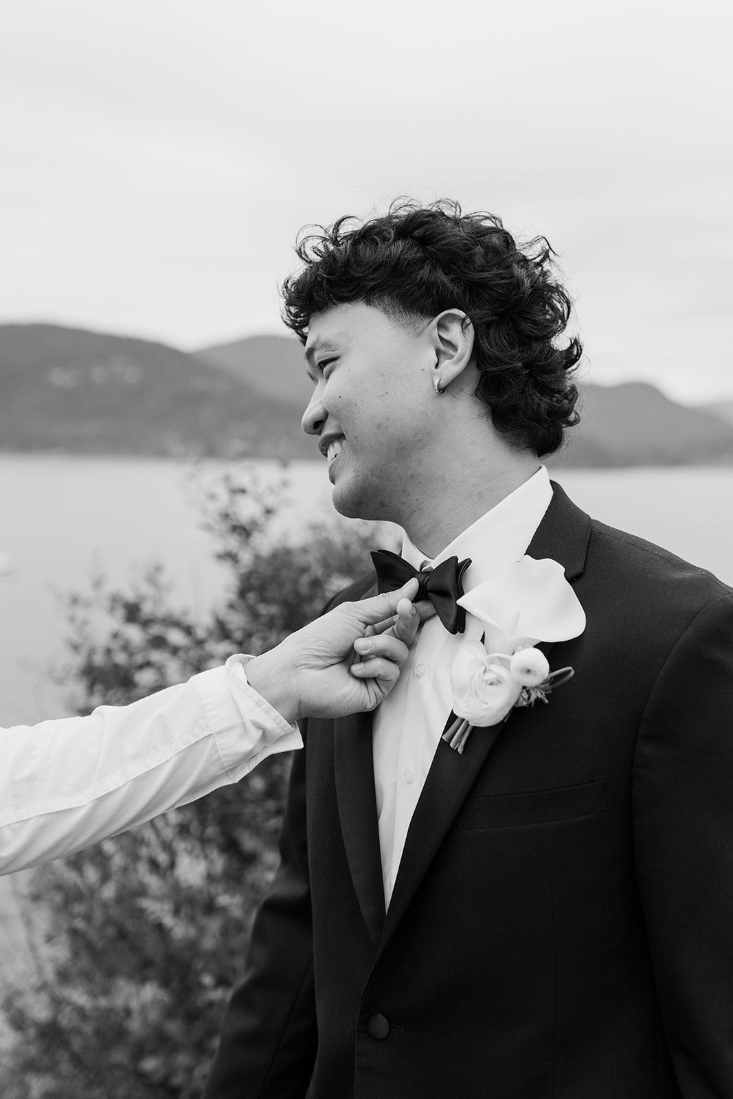 Black and white portraits showing joyful expressions and laughter during a wedding photoshoot.
