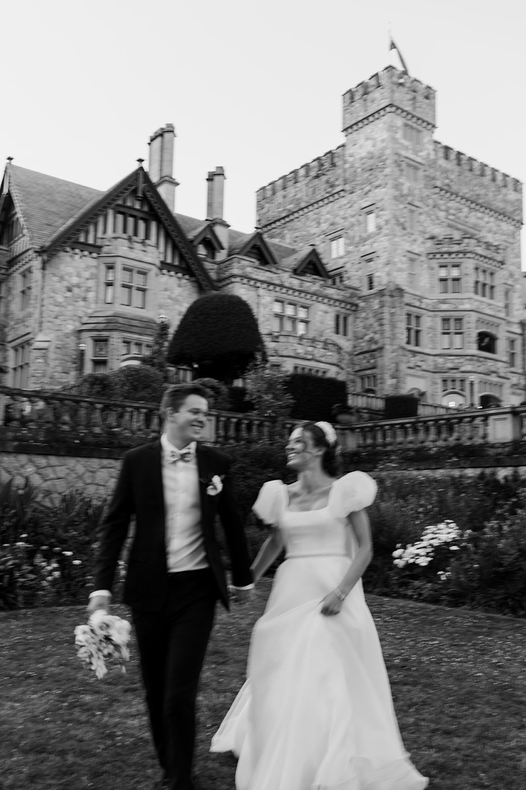 A series of candid wedding photos taken outside a historic stone castle building.