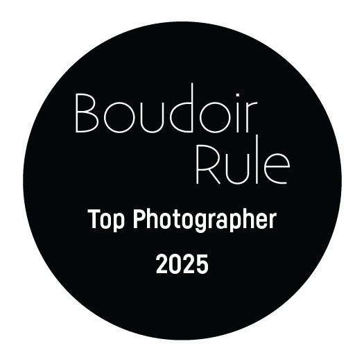 Four circular black badges on white background showing award text related to boudoir photography and recognition.