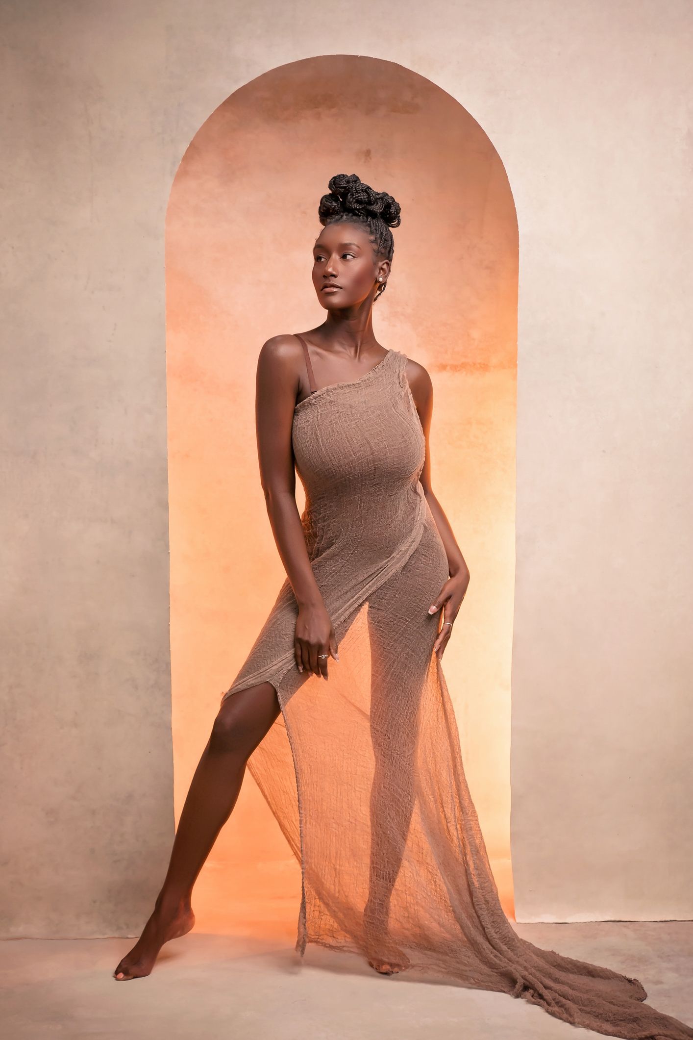 Elegant female portrait photography sequence showing expressive movements in soft orange lighting.