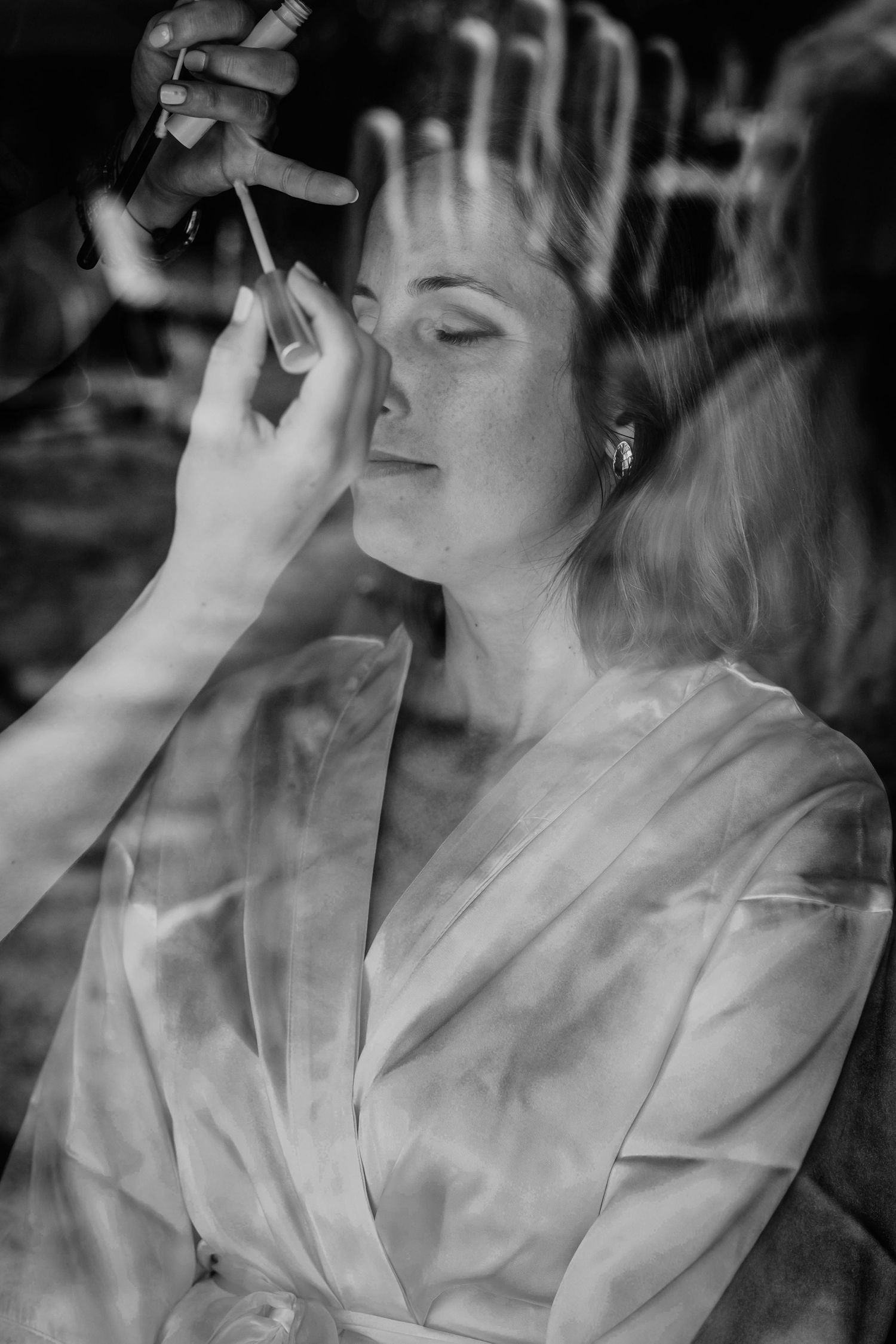 A black and white artistic photo sequence showing someone exhaling cigarette smoke in a dreamy, ethereal style.