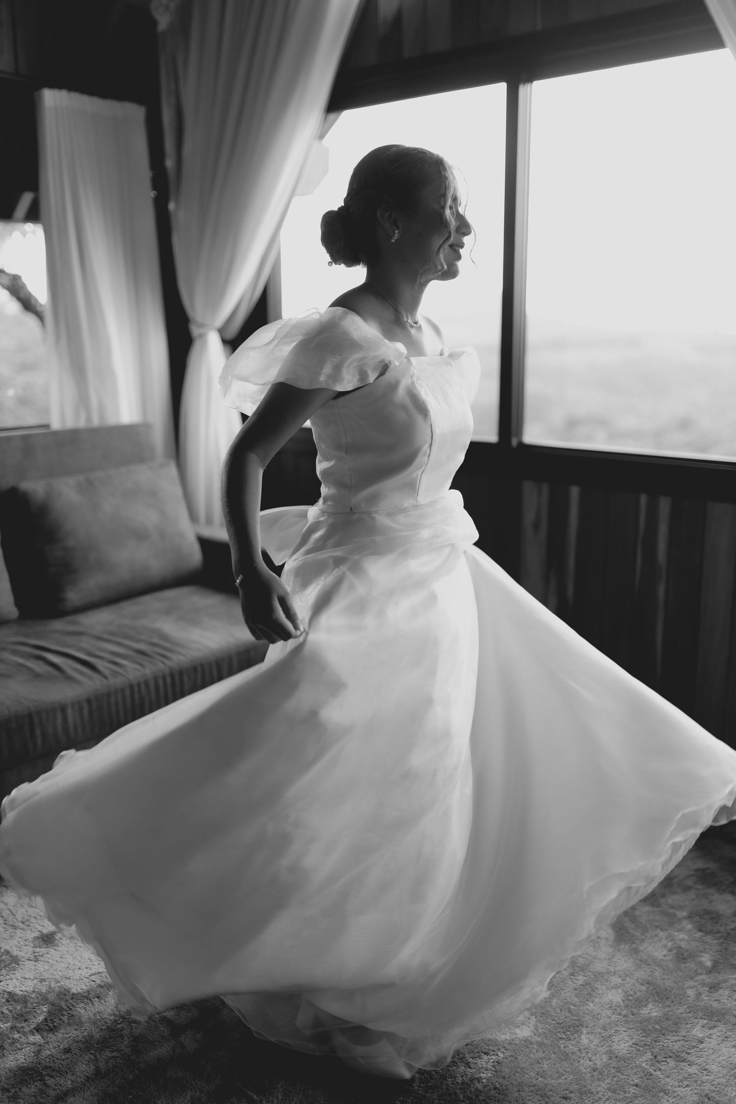 Black and white photos of flowing white wedding dress in motion.